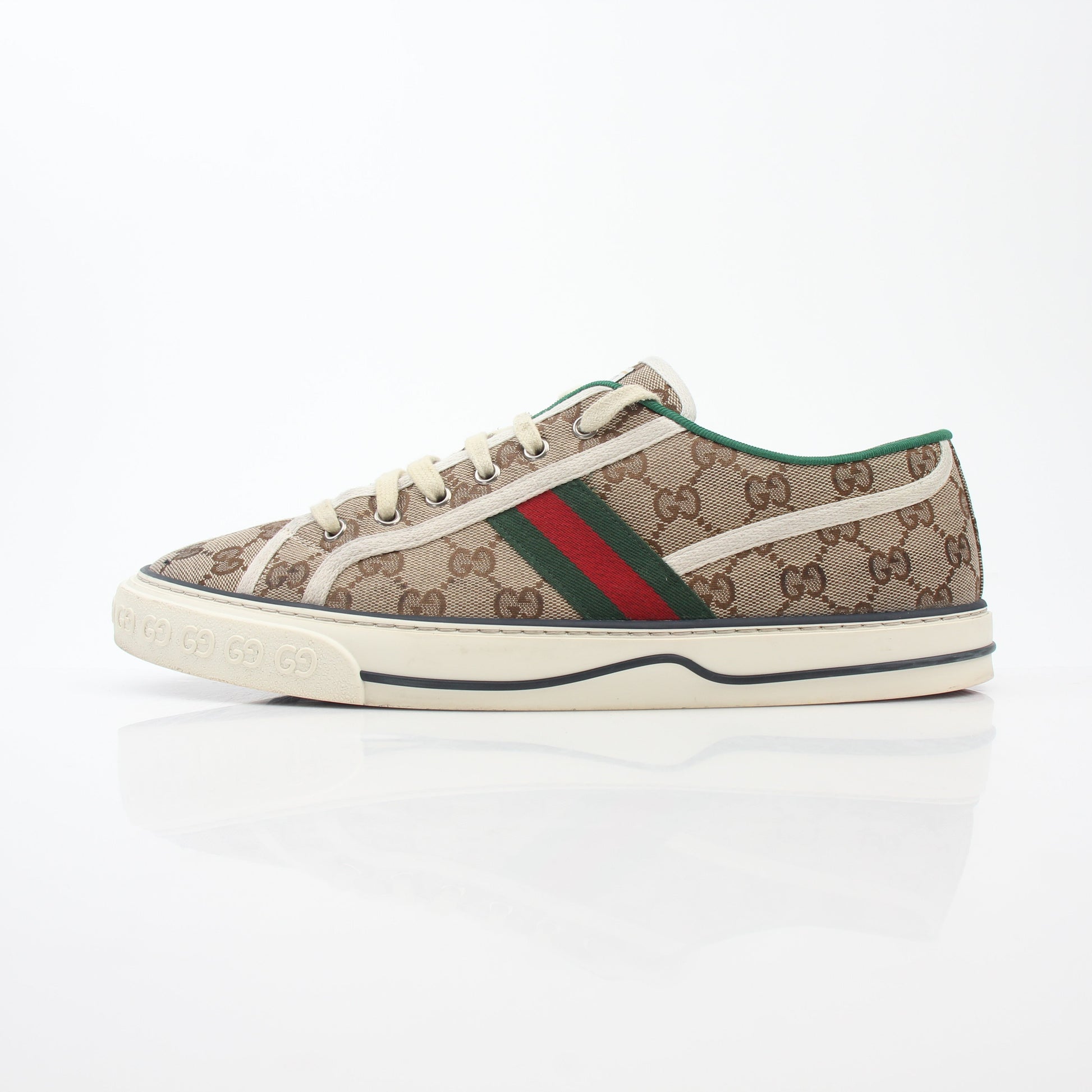 Gold & Beyond Gucci Beige GG Tennis 1977 sneakers with classic design, white rubber soles, and signature GG logo details.