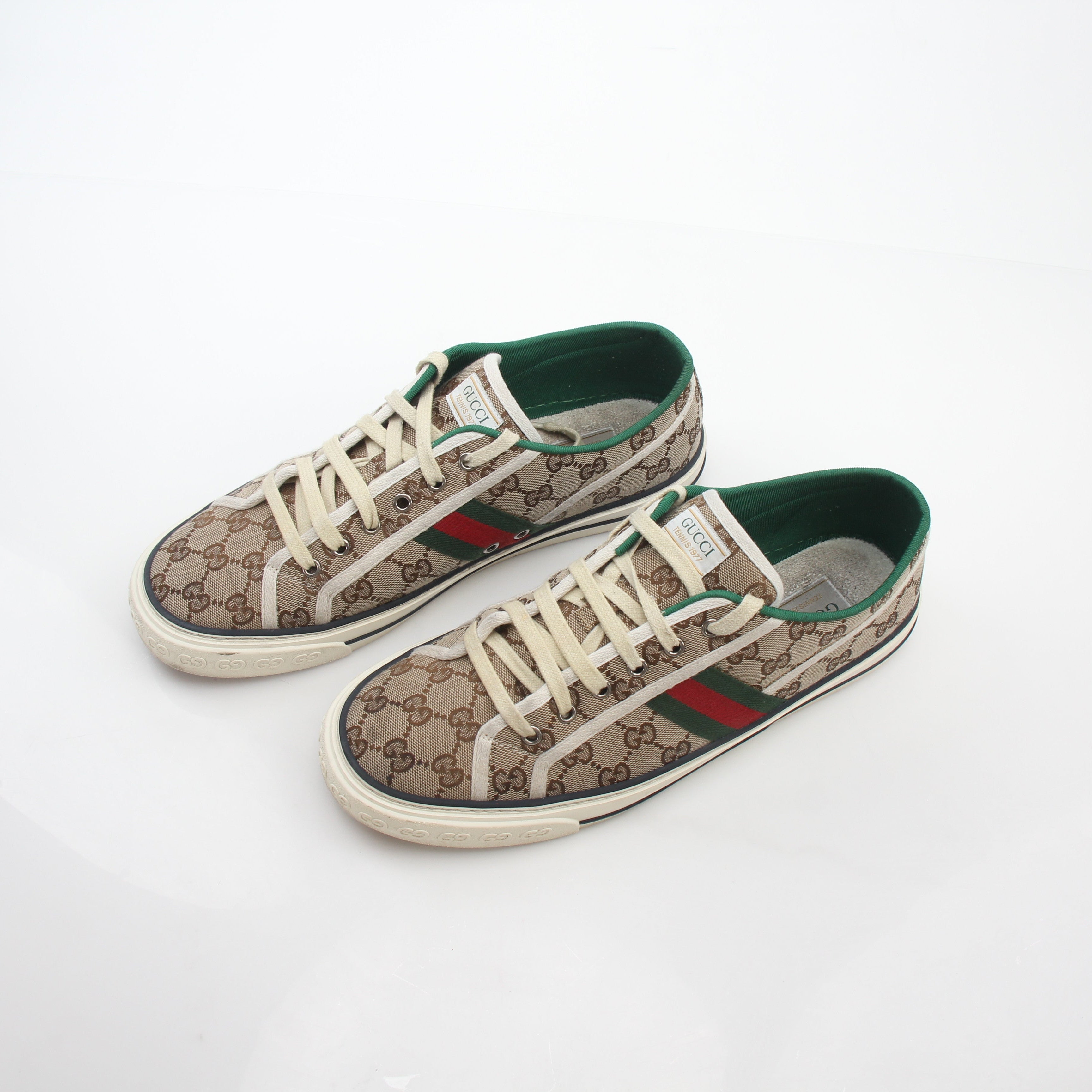 Gold & Beyond Gucci beige GG Tennis 1977 sneakers featuring signature logo and vintage-inspired design, displayed on a neutral background.