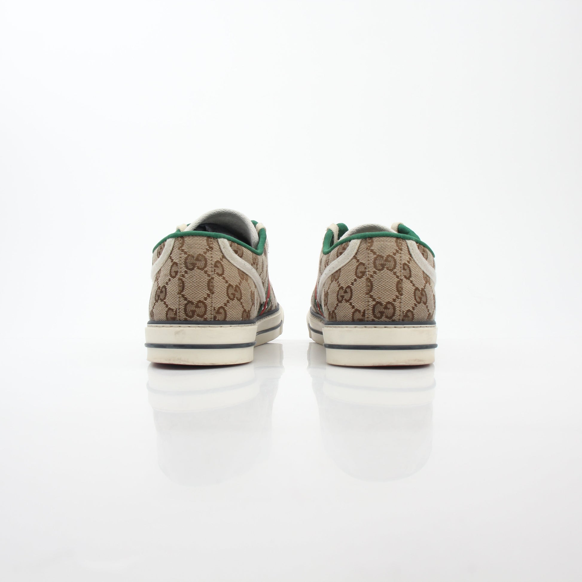 Gold & Beyond Gucci Beige GG Tennis 1977 sneakers, classic shoes with beige canvas and rubber sole, detailed view of stylish footwear.
