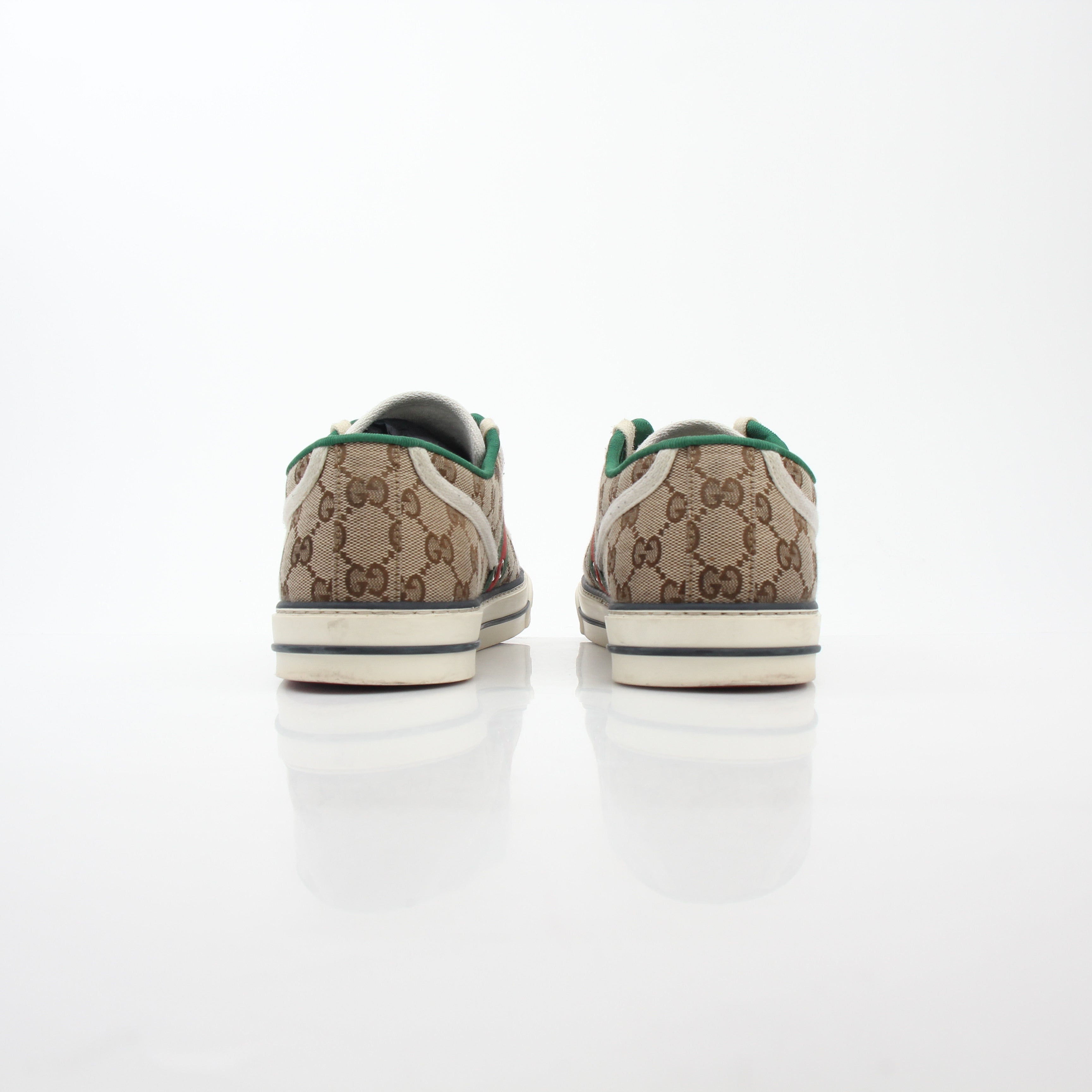 Gold & Beyond Gucci Beige GG Tennis 1977 sneakers, classic shoes with beige canvas and rubber sole, detailed view of stylish footwear.