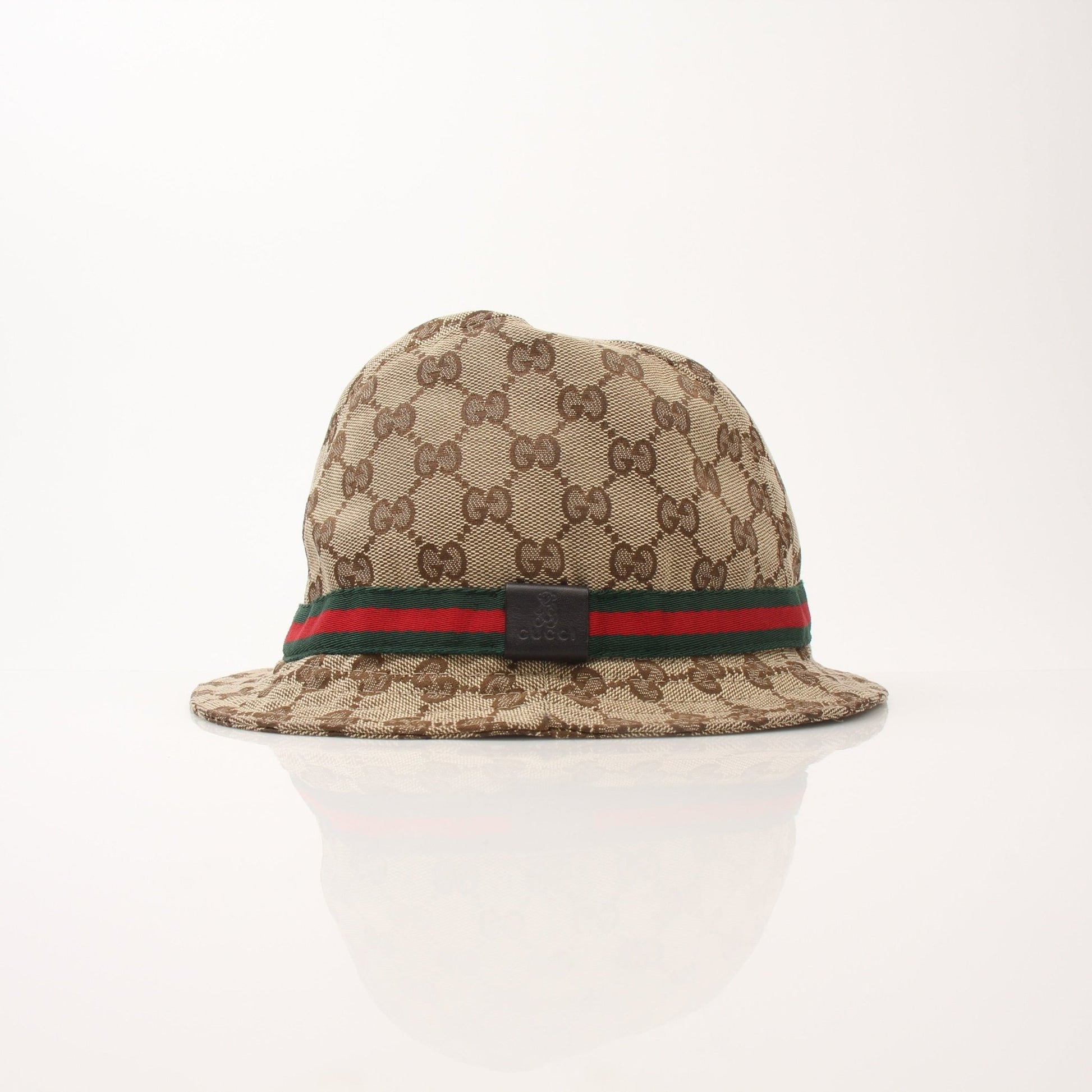 Gucci GG Canvas Bucket Hat, stylish accessories with iconic logo print, shown on a neutral background.
