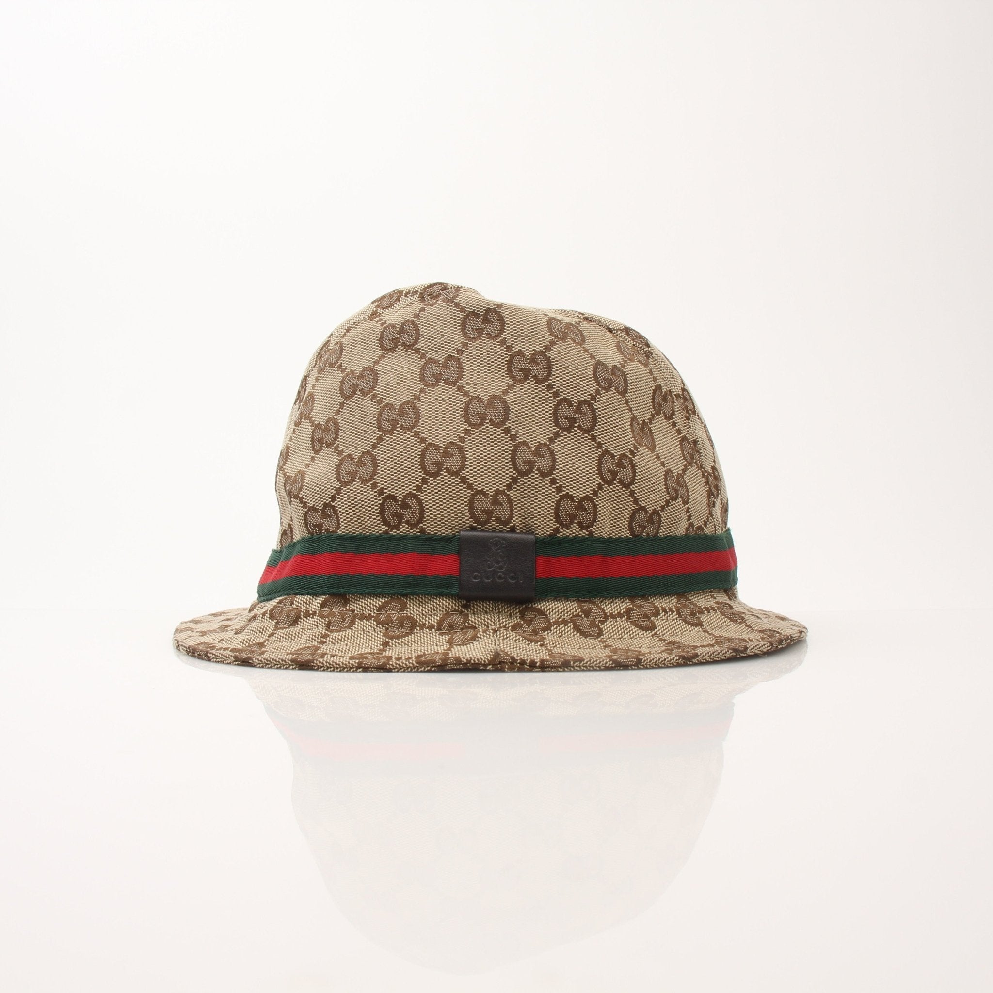 Gucci GG Canvas Bucket Hat, stylish accessories with iconic logo print, shown on a neutral background.