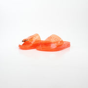 Gucci orange Pursuit logo slide sandals with open toe design and branded strap, displayed on a white background.
