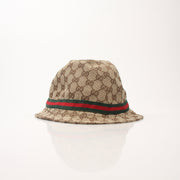 Gucci GG canvas bucket hat in beige with logo print, stylish accessory for sun protection and fashion.