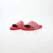 Gold & Beyond MCM red logo print slide sandals with open toe and comfortable slip-on design.