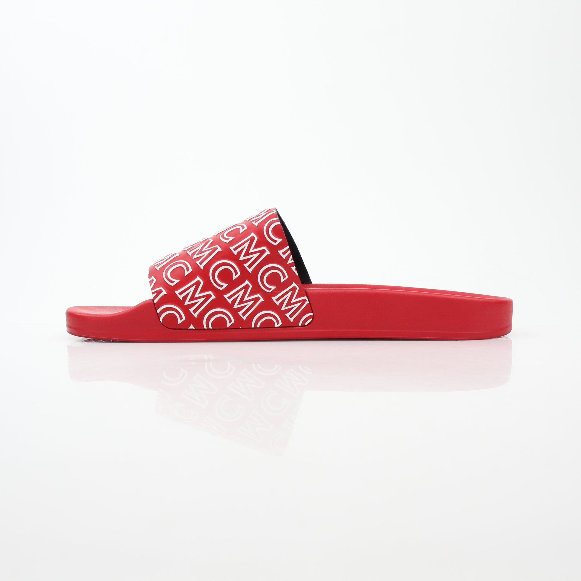 Red MCM logo print slide sandals from Gold & Beyond showing the stylish slip-on design and branded logo on the straps.