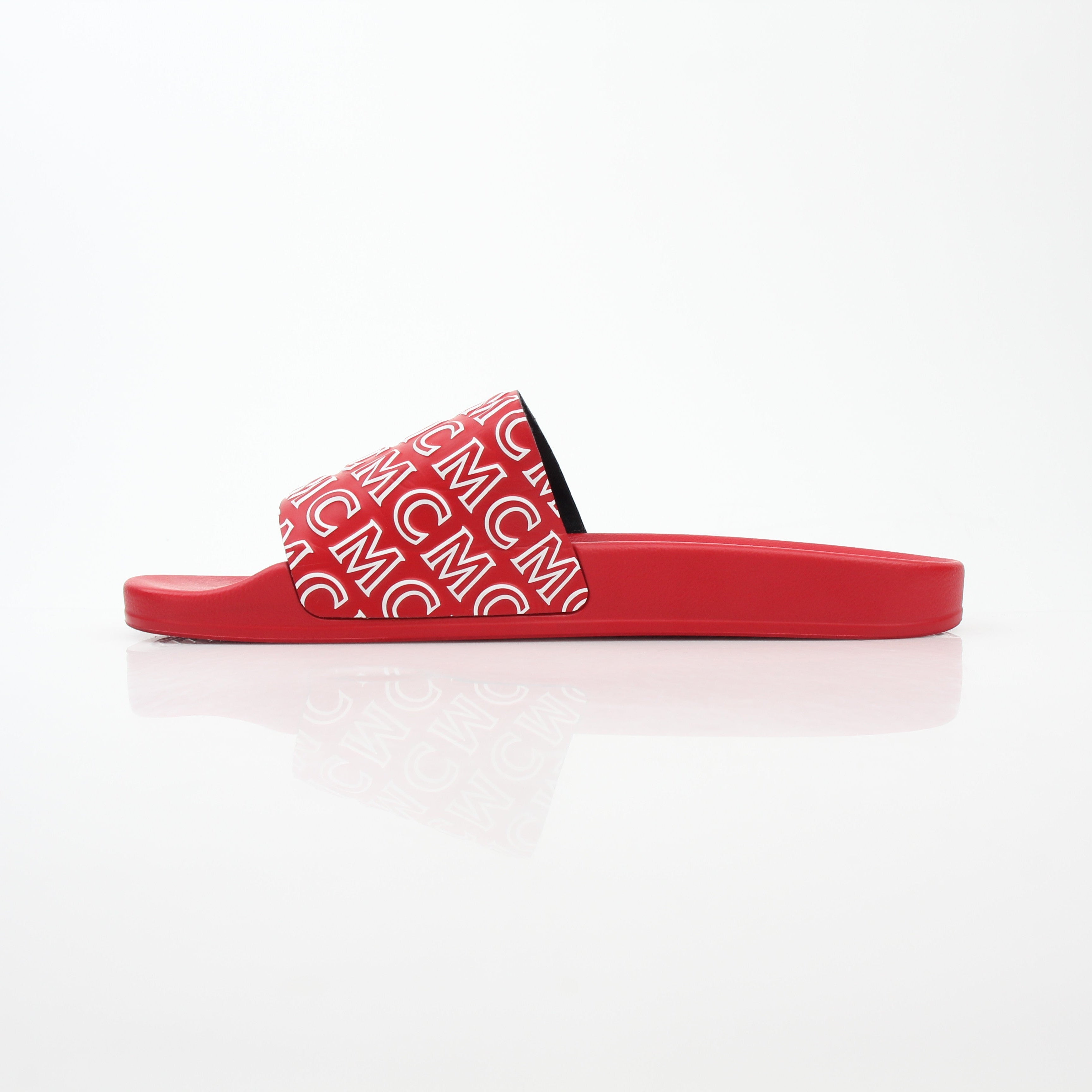Red MCM logo print slide sandals from Gold & Beyond showing the stylish slip-on design and branded logo on the straps.