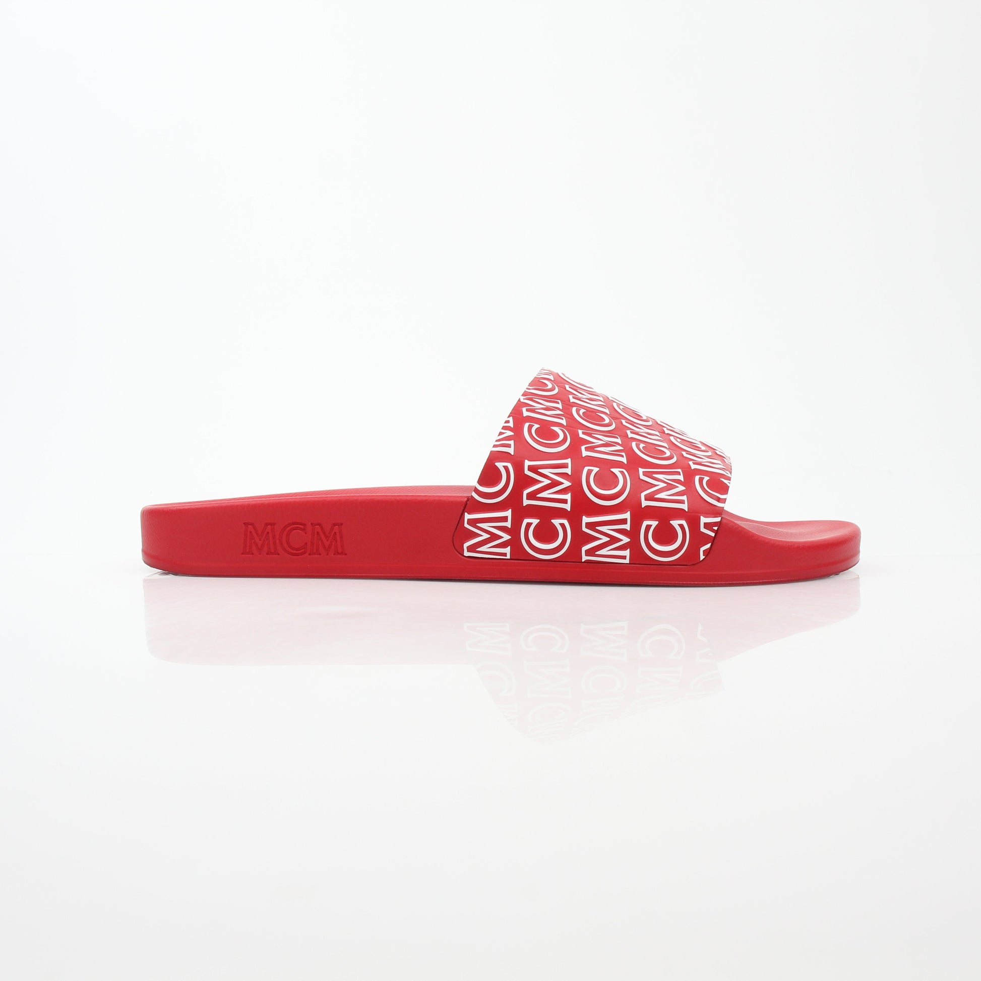 Gold & Beyond MCM red logo print slide sandals featuring comfortable slide design and bold brand logo on the straps.