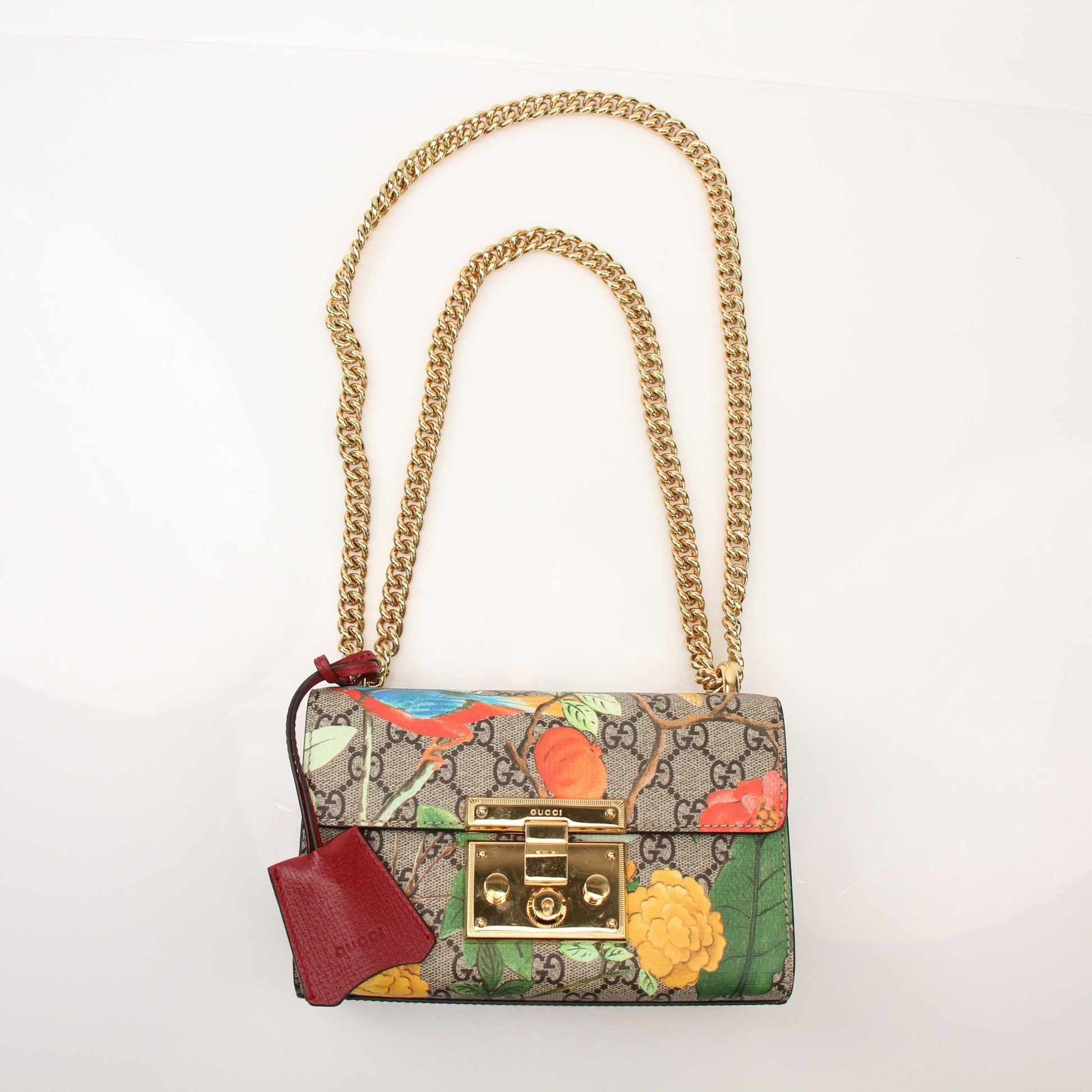Gold & Beyond Gucci Tian Padlock Shoulder Bag handbag with gold hardware and quilted leather design, shown from a front view.