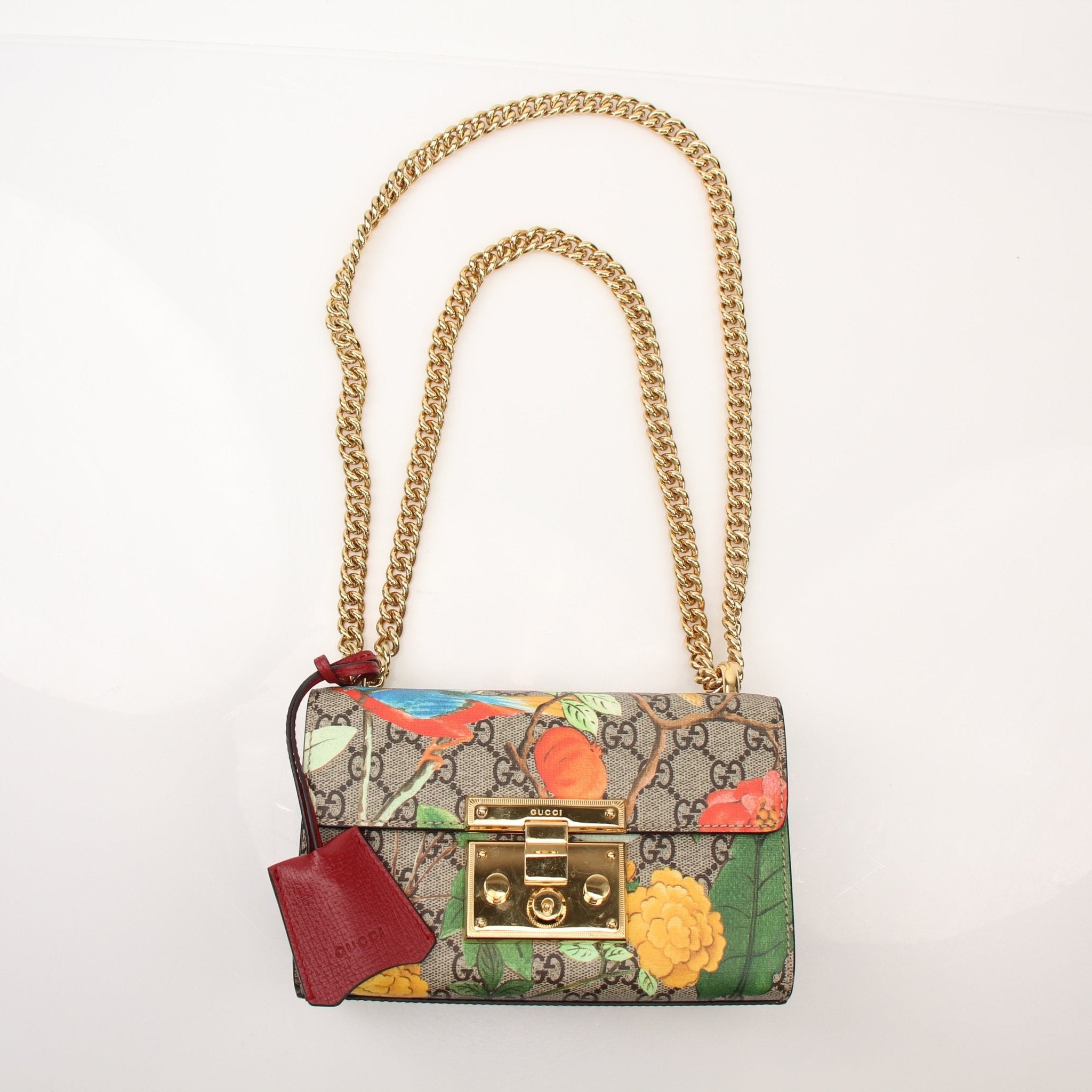 Gold & Beyond Gucci Tian Padlock Shoulder Bag handbag with gold hardware and quilted leather design, shown from a front view.