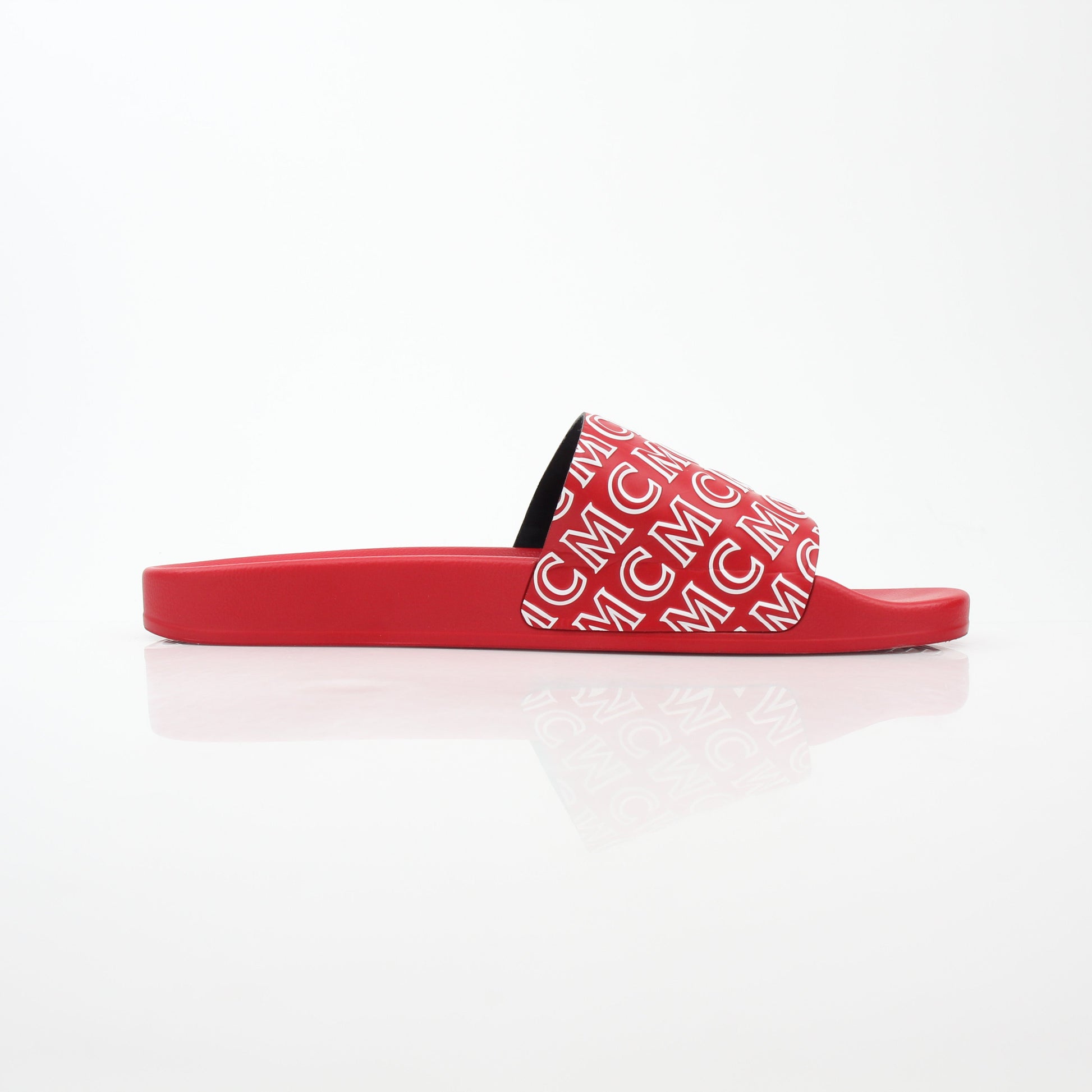 Red MCM logo print slide sandals by Gold & Beyond, showcasing sleek designer footwear with comfortable slip-on style.