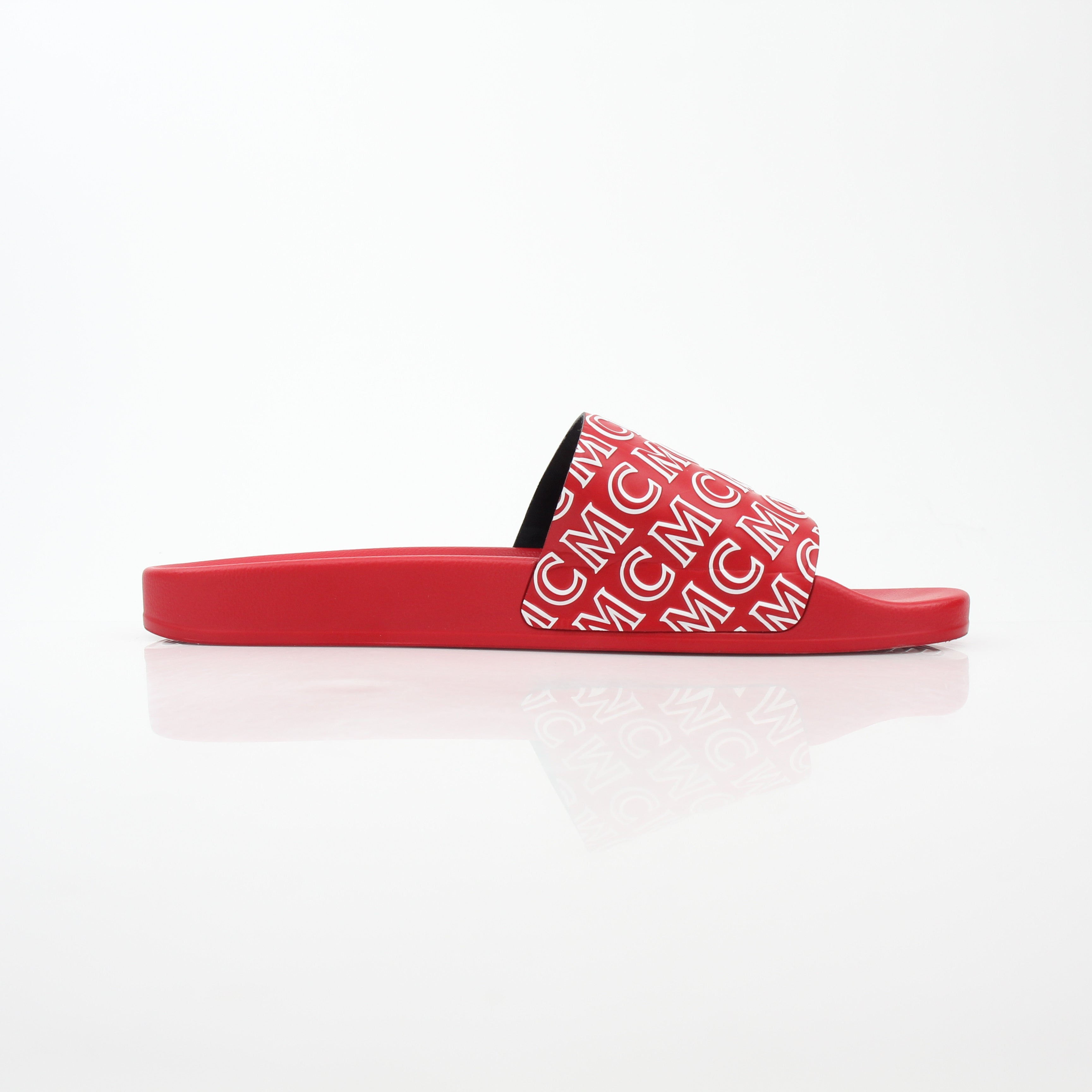 Red MCM logo print slide sandals by Gold & Beyond, showcasing sleek designer footwear with comfortable slip-on style.