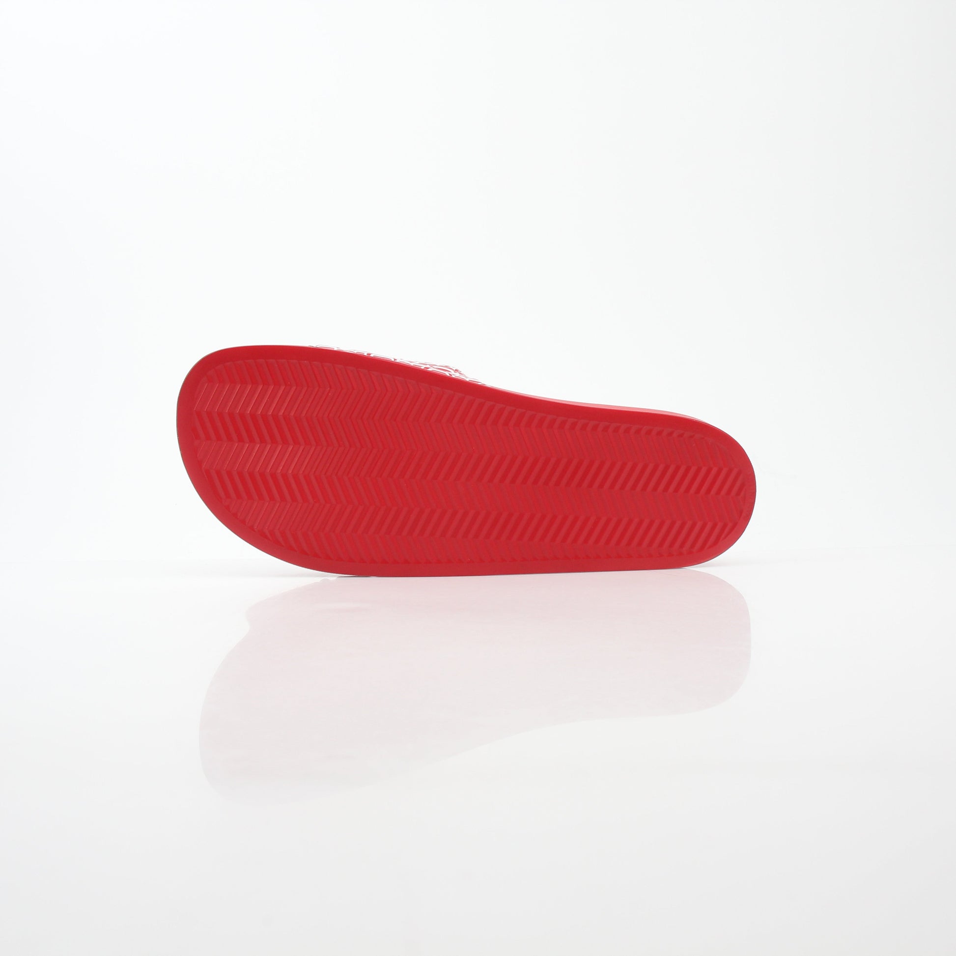 Red MCM logo print slide sandals from Gold & Beyond, featuring comfortable open-toe design and stylish branding.