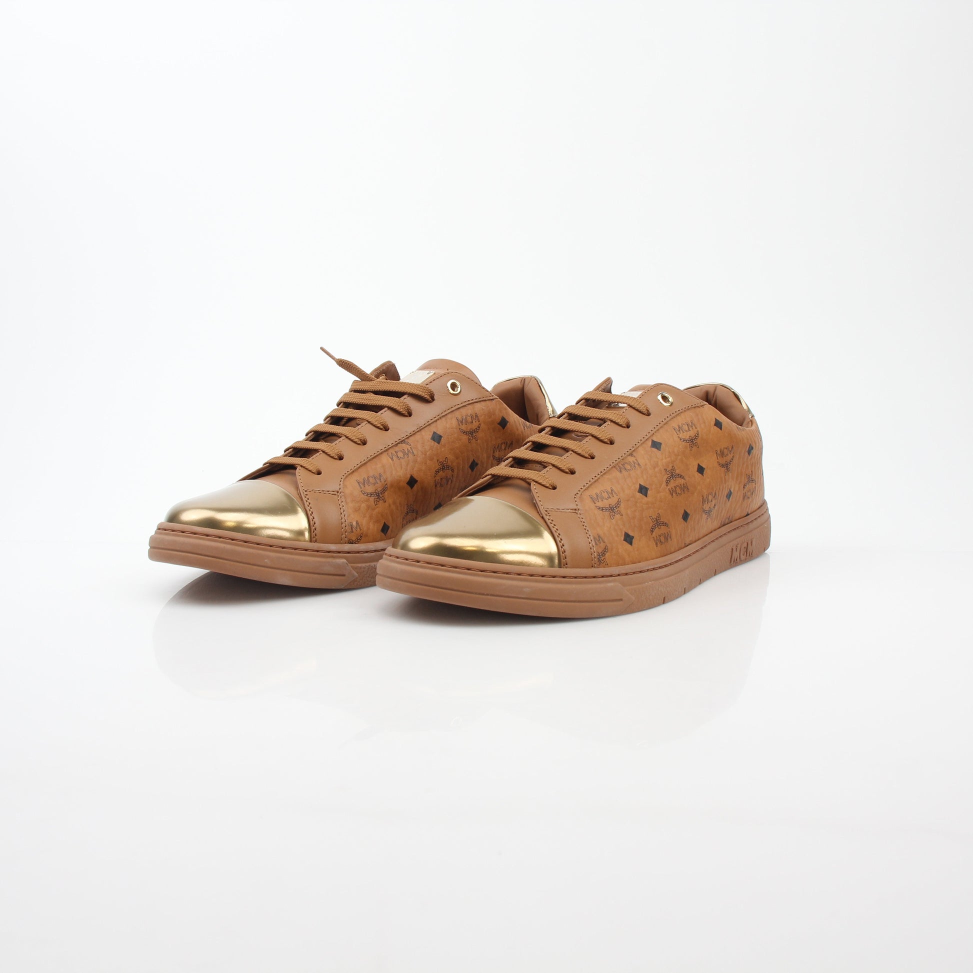 Gold & Beyond MCM Cognac Terrain low-top sneakers with stylish design and textured sole, casual shoes for everyday wear.