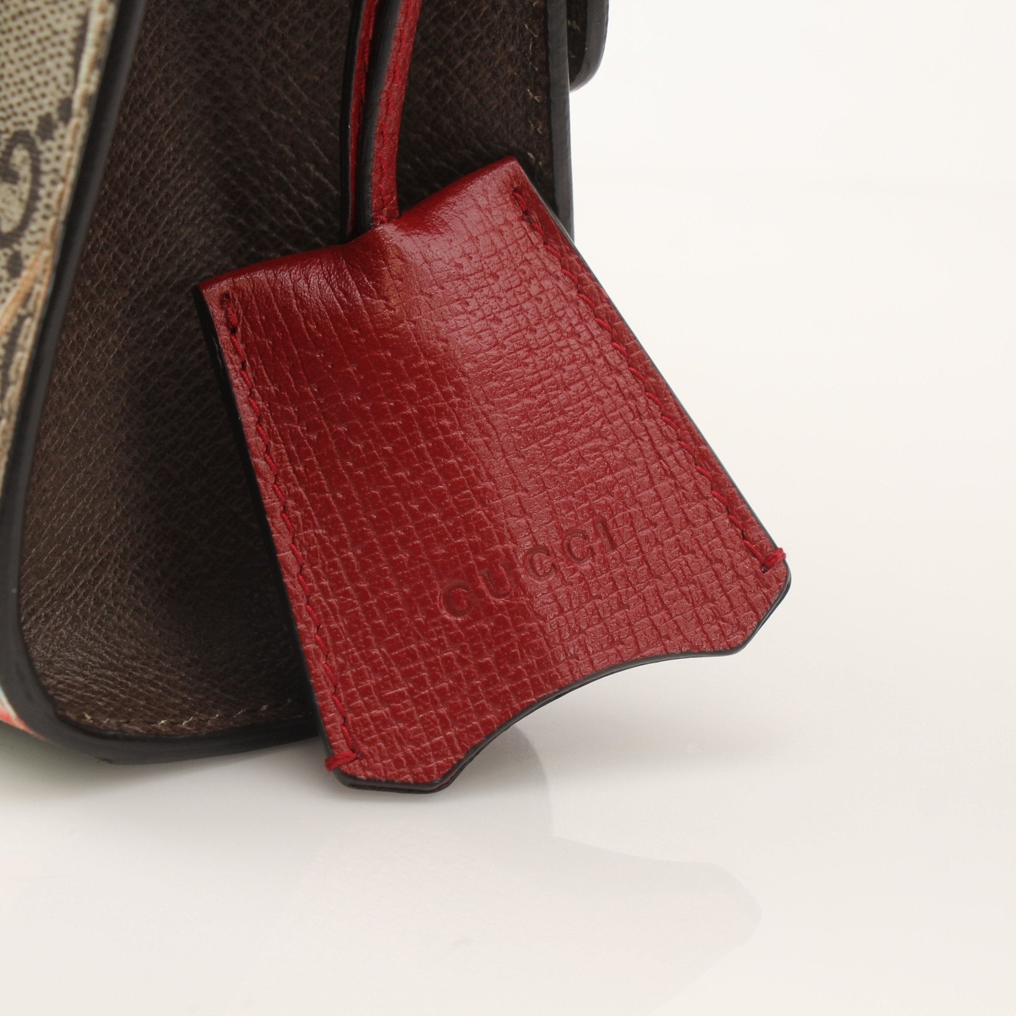Gucci Tian Padlock Shoulder Bag, gold-tone hardware, structured handbag with logo details and shoulder strap.