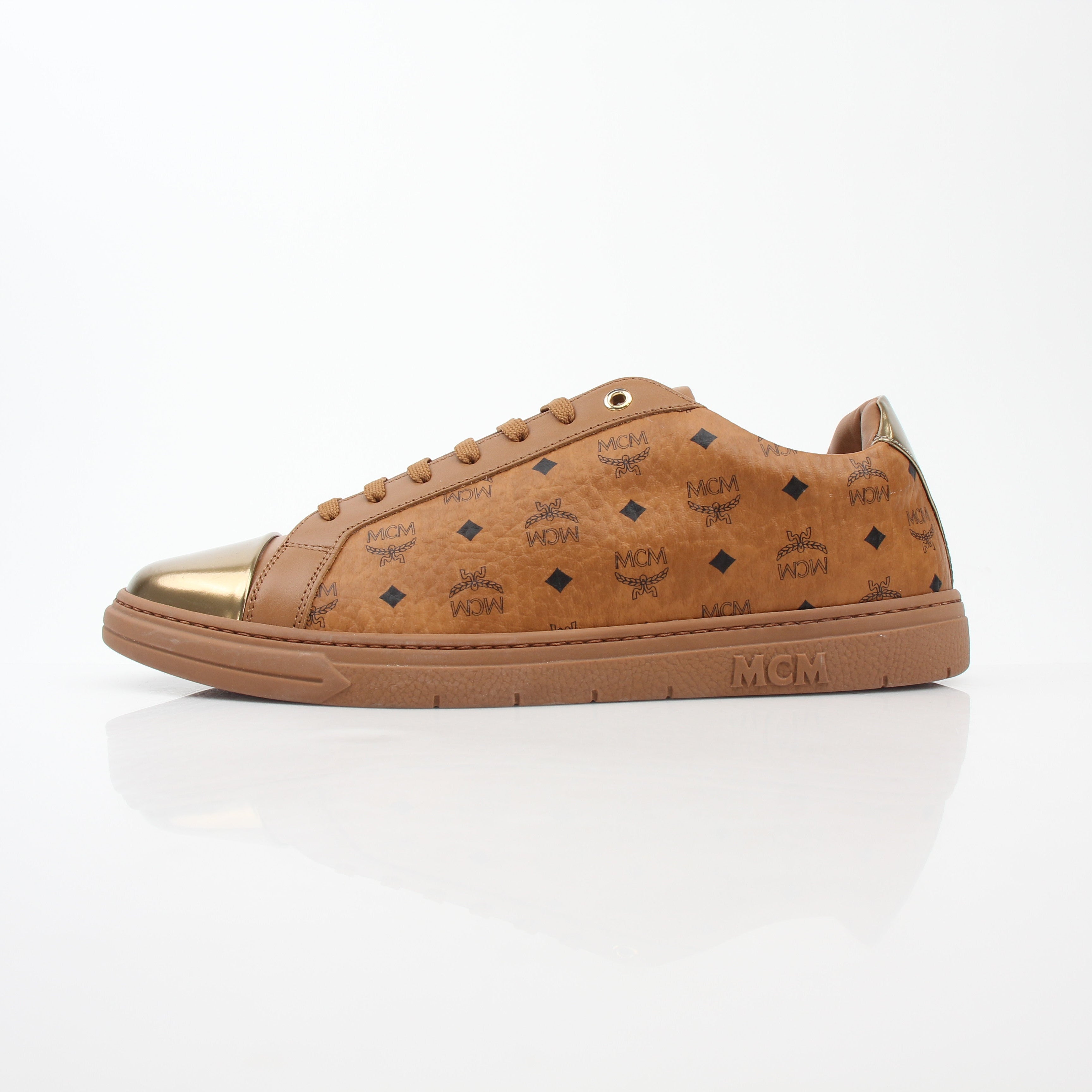 Gold & Beyond MCM Cognac Terrain low-top sneakers with textured leather and rubber soles, stylish casual shoes for everyday wear.