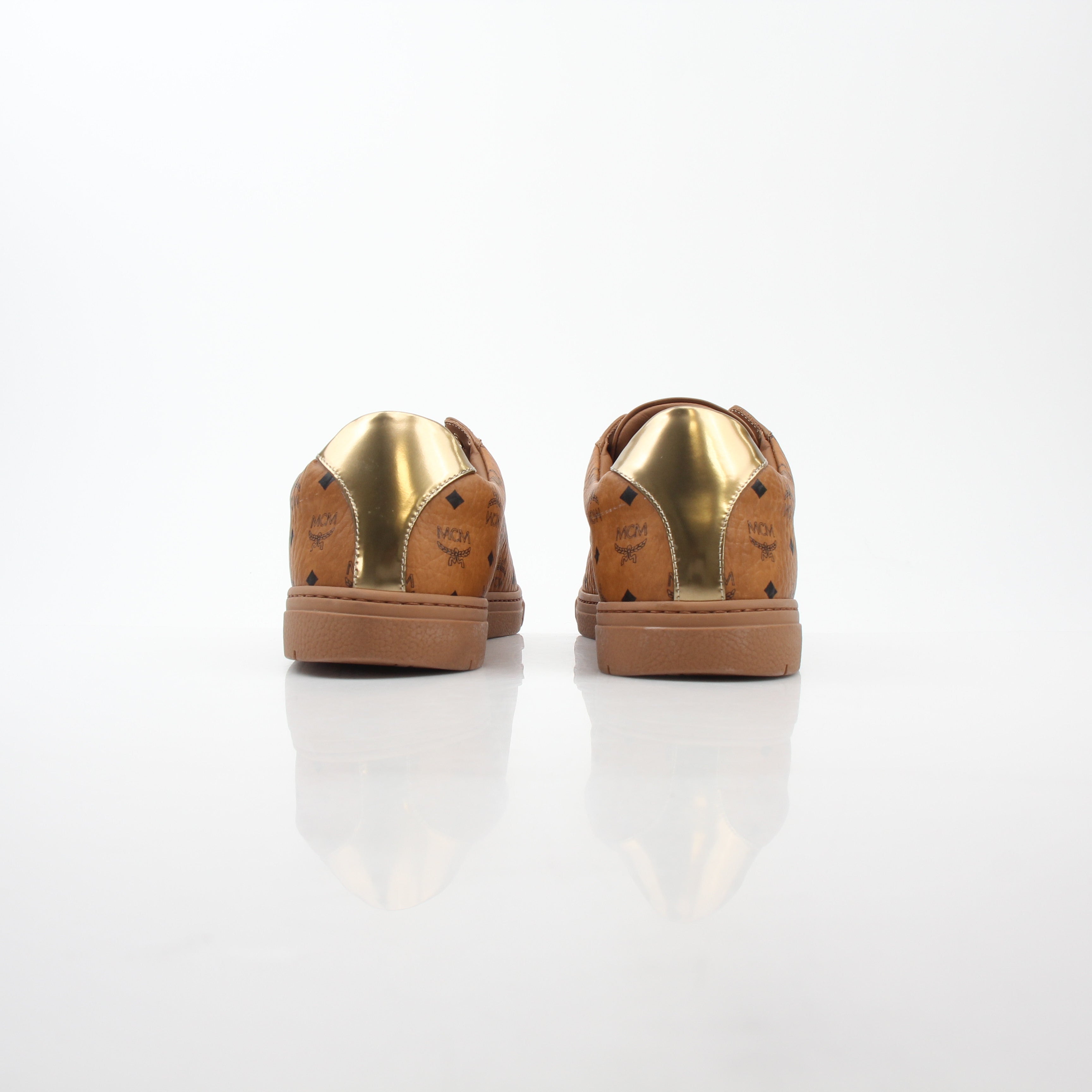 Gold & Beyond MCM Cognac Terrain low-top sneakers with stylish design and textured sole for casual wear.