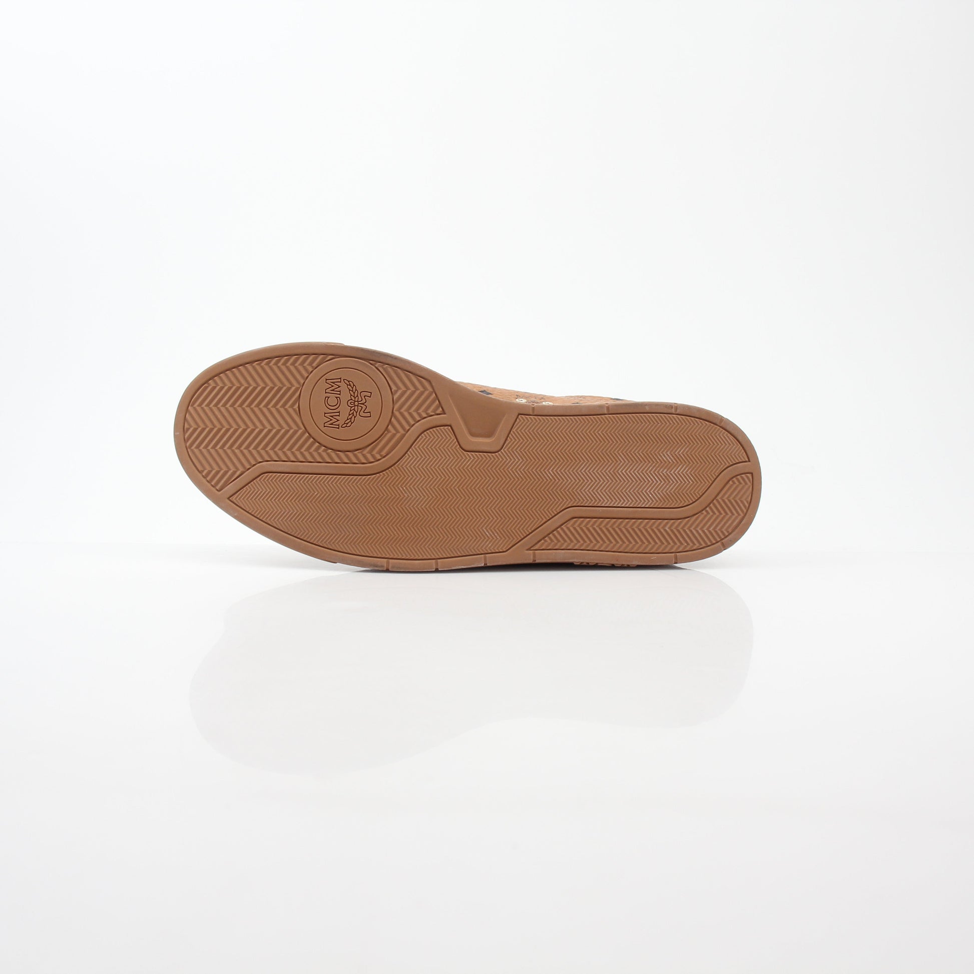 Gold & Beyond MCM Cognac Terrain low-top sneakers with stylish design and comfortable fit, shown on a plain background.