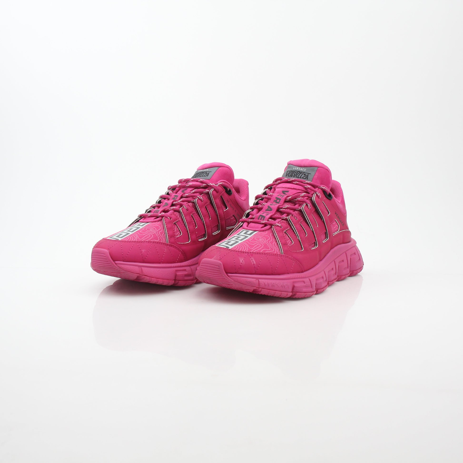 Gold & Beyond Versace Pink Trigreca low-top sneakers with stylish design, featuring pink accents and comfortable shoe construction.
