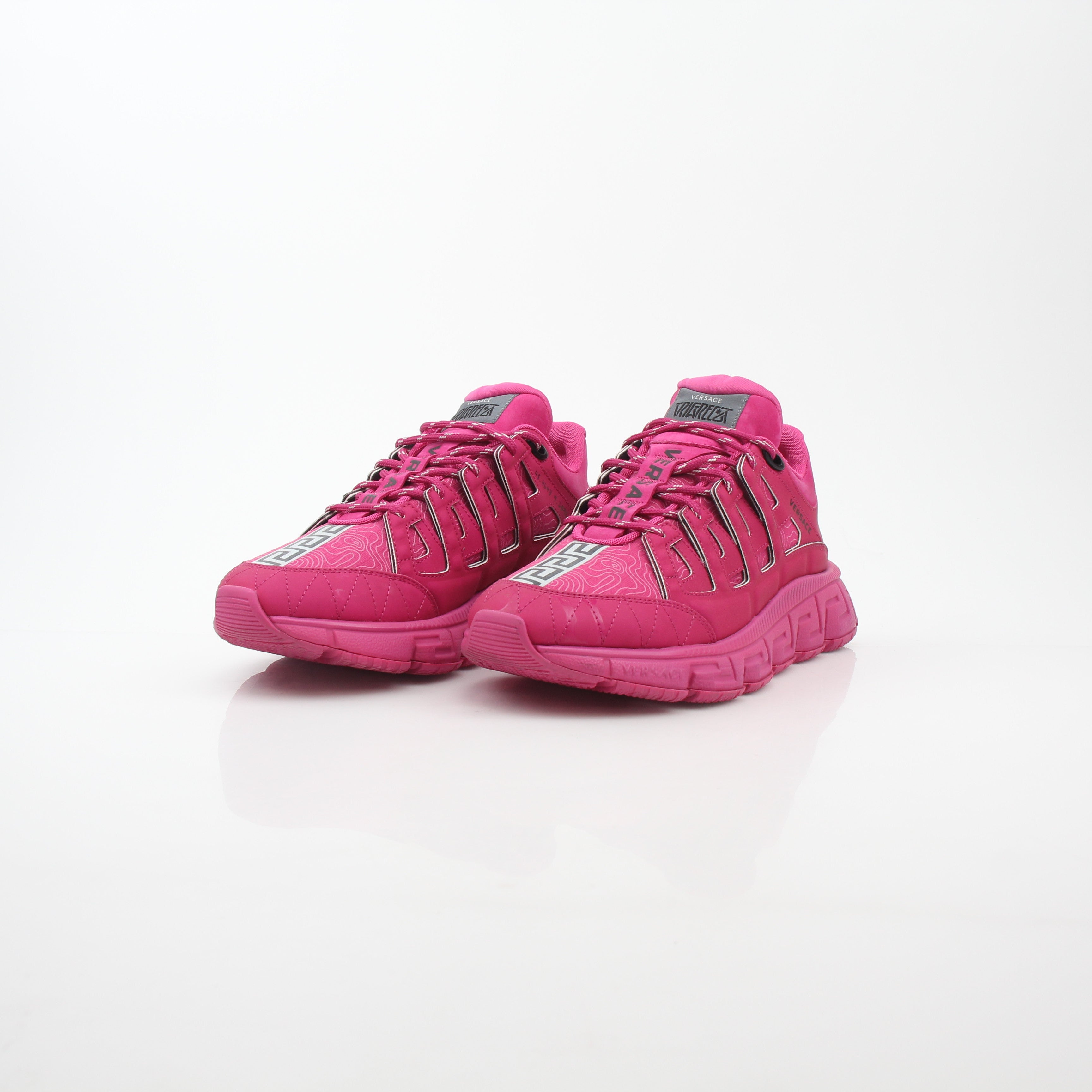 Gold & Beyond Versace Pink Trigreca low-top sneakers with stylish design, featuring pink accents and comfortable shoe construction.