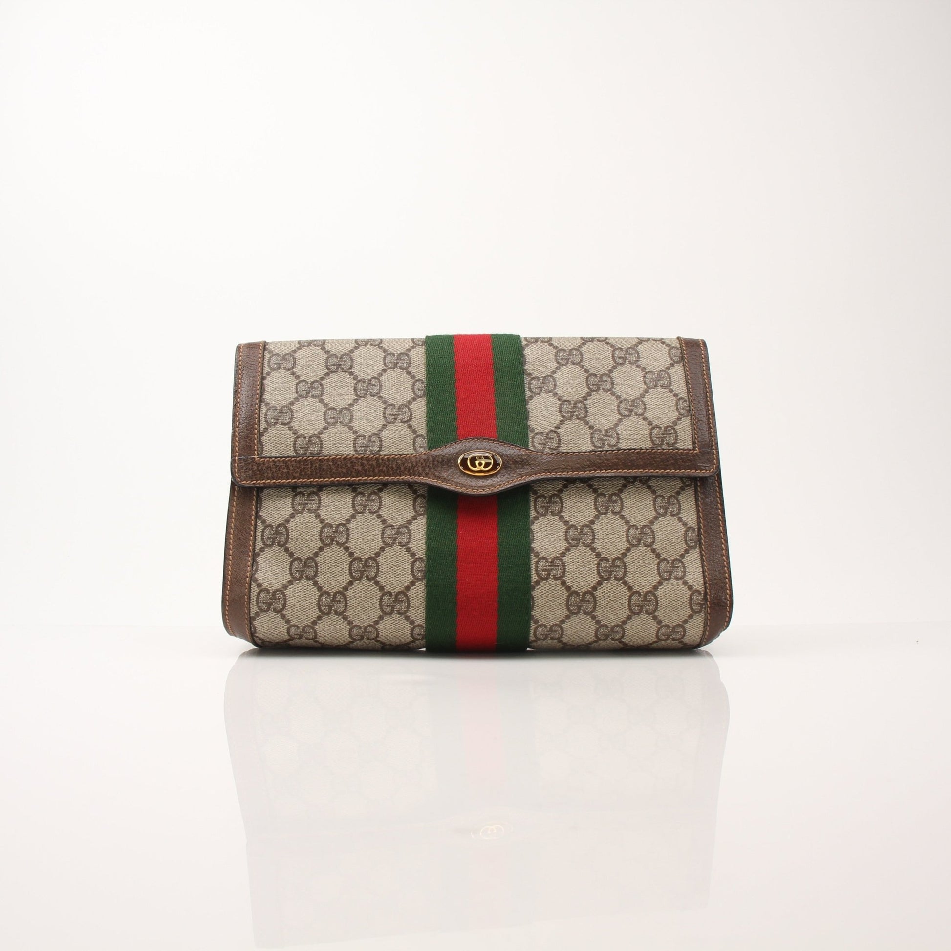 Gucci Vintage Clutch Handbag by Gold & Beyond with elegant design and textured leather surface.