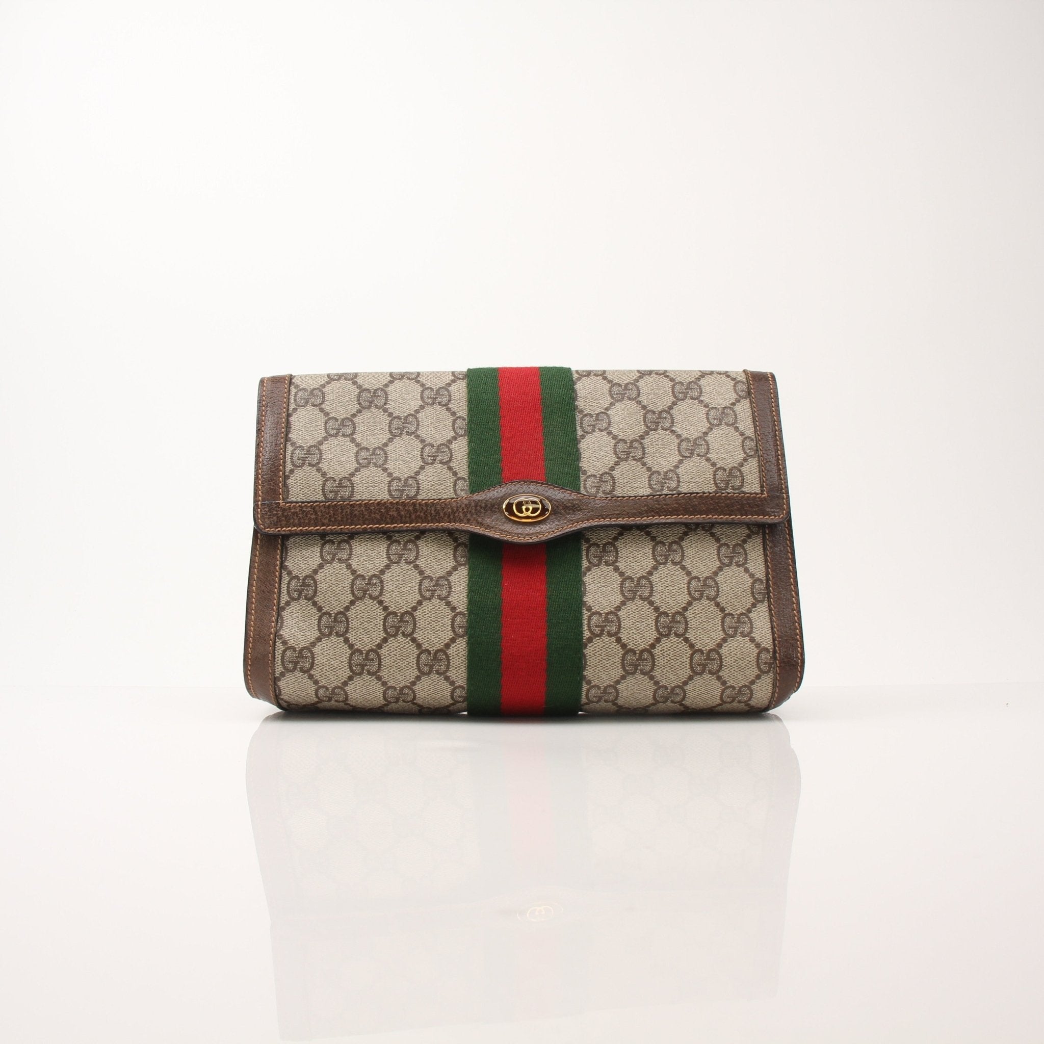 Gucci Vintage Clutch Handbag by Gold & Beyond with elegant design and textured leather surface.