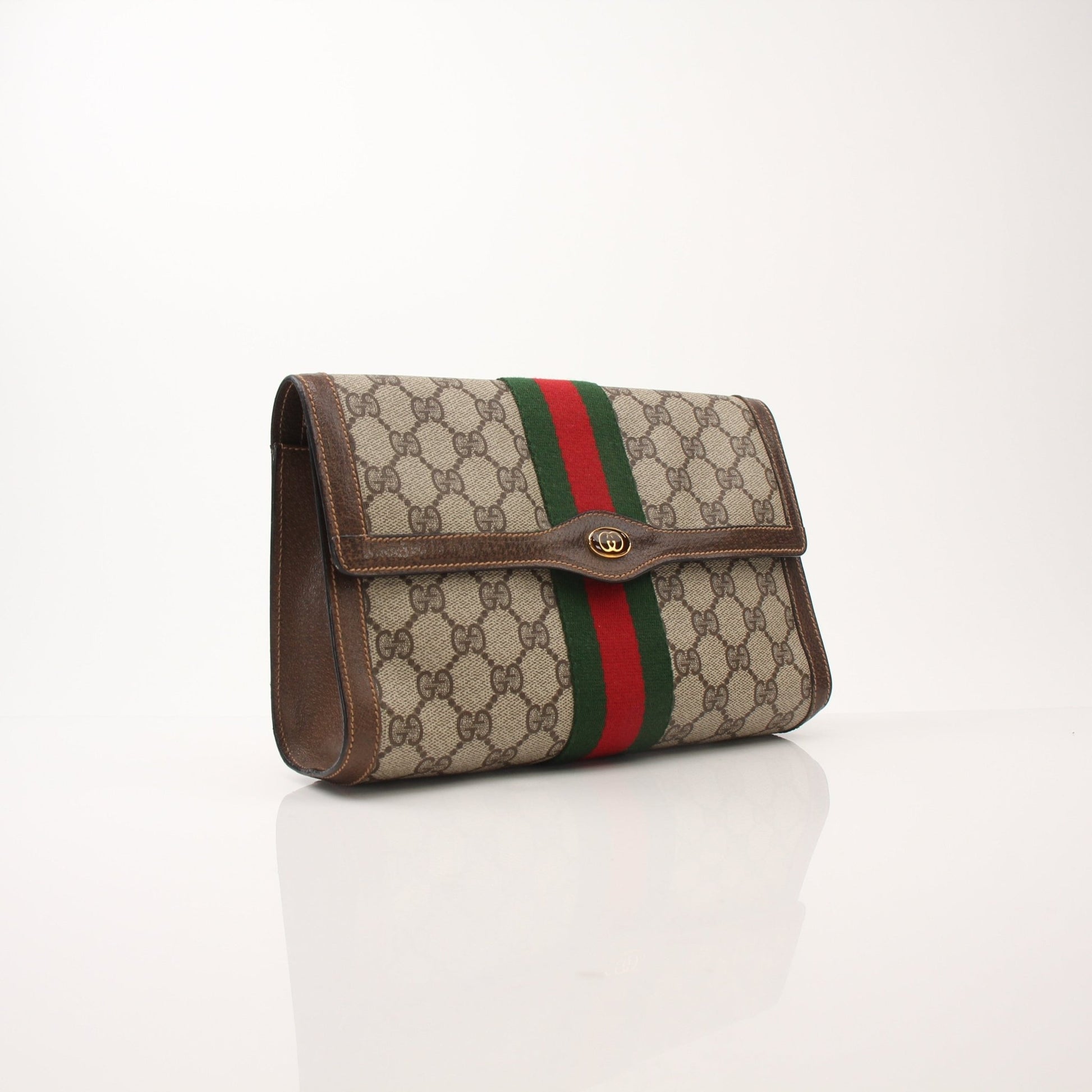Gucci Vintage Clutch Bag by Gold & Beyond, elegant handbag with classic design, featuring textured leather and gold accents.