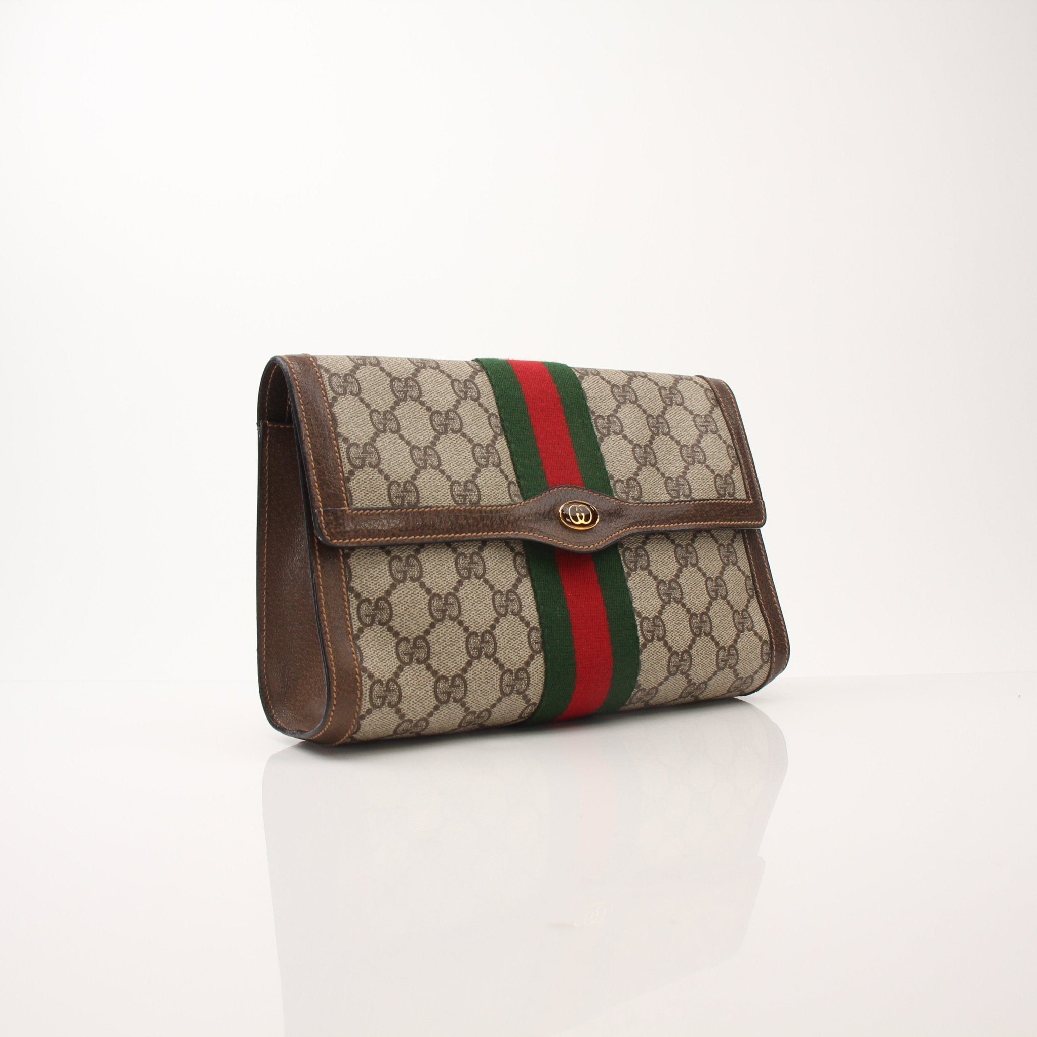 Gucci Vintage Clutch Bag by Gold & Beyond, elegant handbag with classic design, featuring textured leather and gold accents.