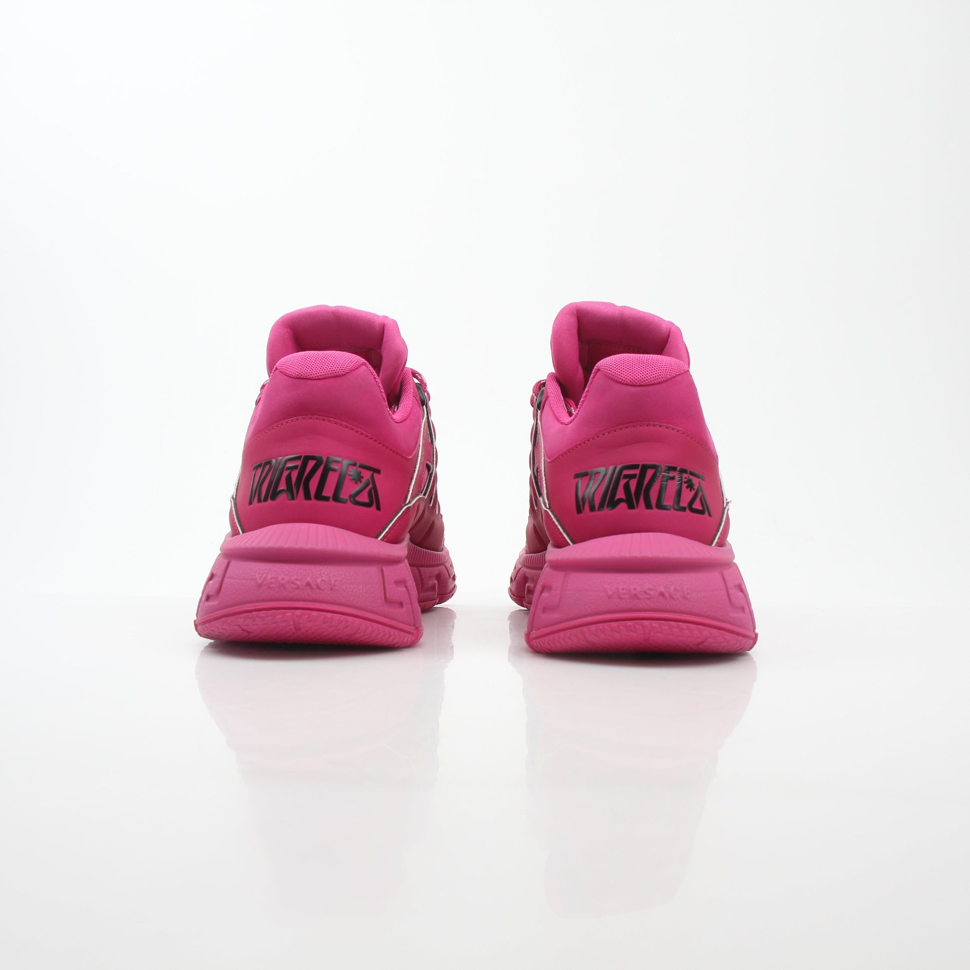 Gold & Beyond Versace Pink Trigreca low-top sneakers with stylish design and white rubber soles.