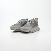 Gray Chain Reaction sneakers by Versace featuring stylish design, white soles, and gray laces on a clean background.