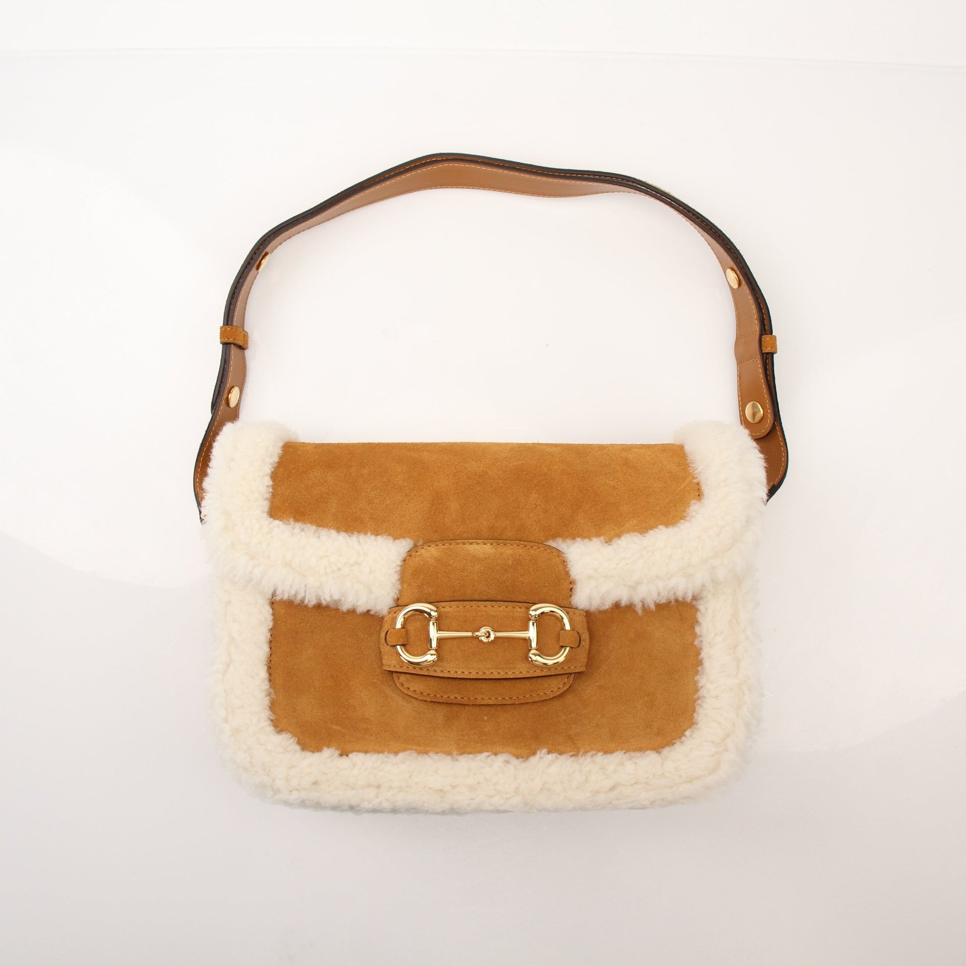 Gucci Suede Shearling Horsebit 1955 shoulder handbag with gold hardware and luxurious suede finish.