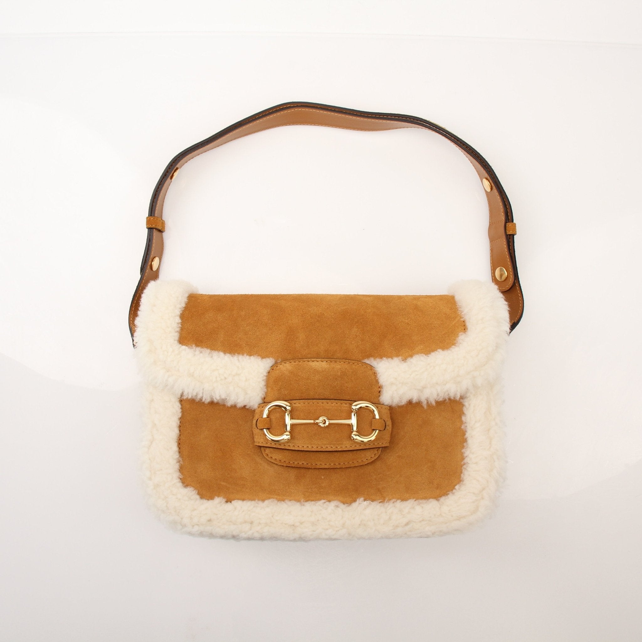 Gucci Suede Shearling Horsebit 1955 shoulder handbag with gold hardware and luxurious suede finish.