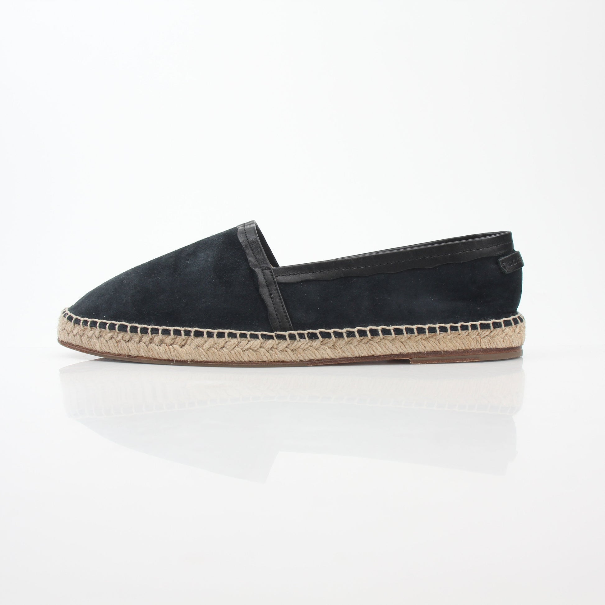 Black suede Dolce & Gabbana espadrille shoes with a woven jute sole and slip-on style, displayed on a neutral background.