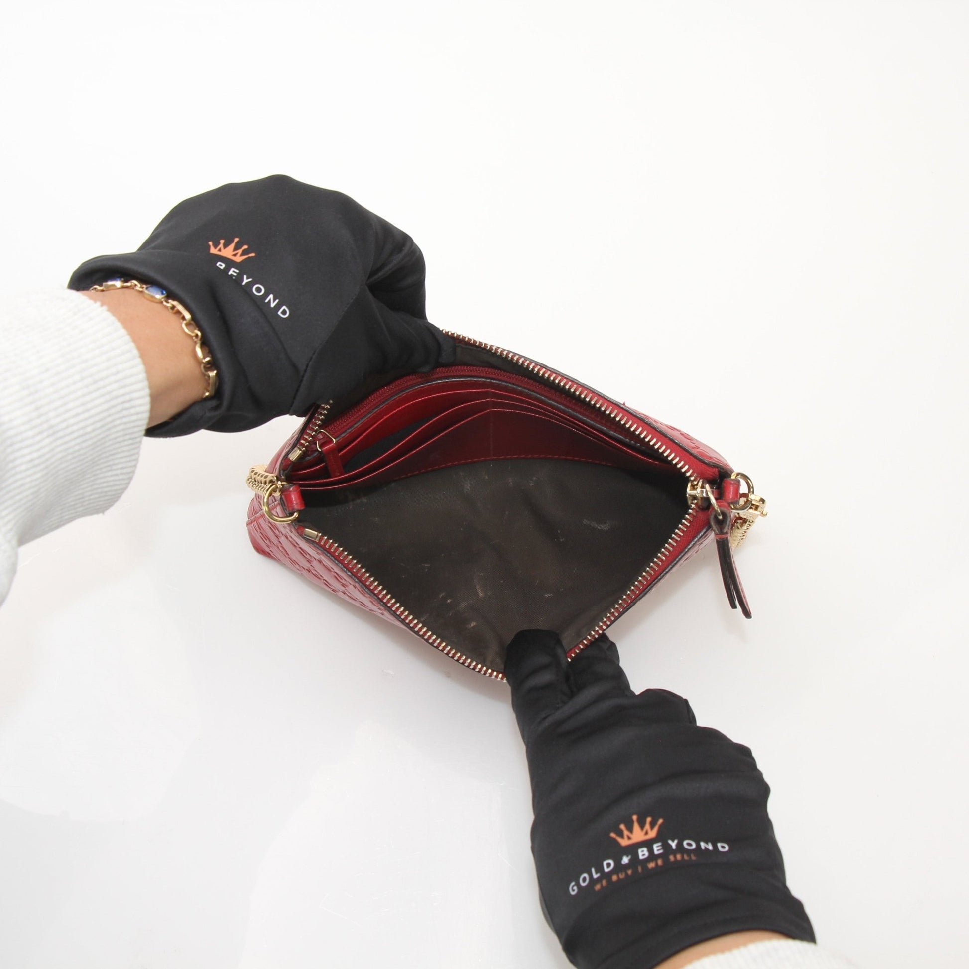 Gucci Guccissima leather chain shoulder handbag with gold hardware and adjustable strap, featuring signature monogram pattern and elegant design.