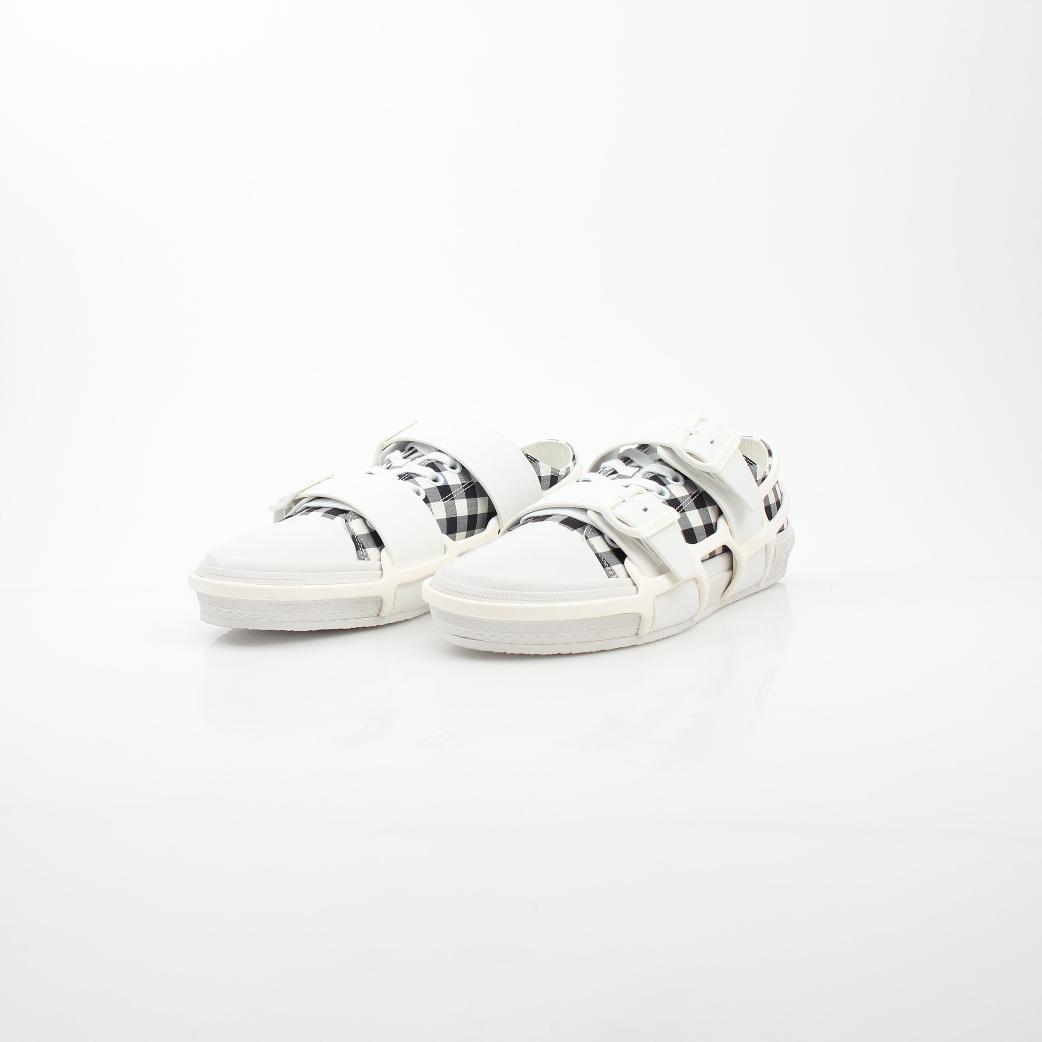 Gold & Beyond Burberry black and white gingham Webb low-top sneakers with white rubber soles and lace-up front.