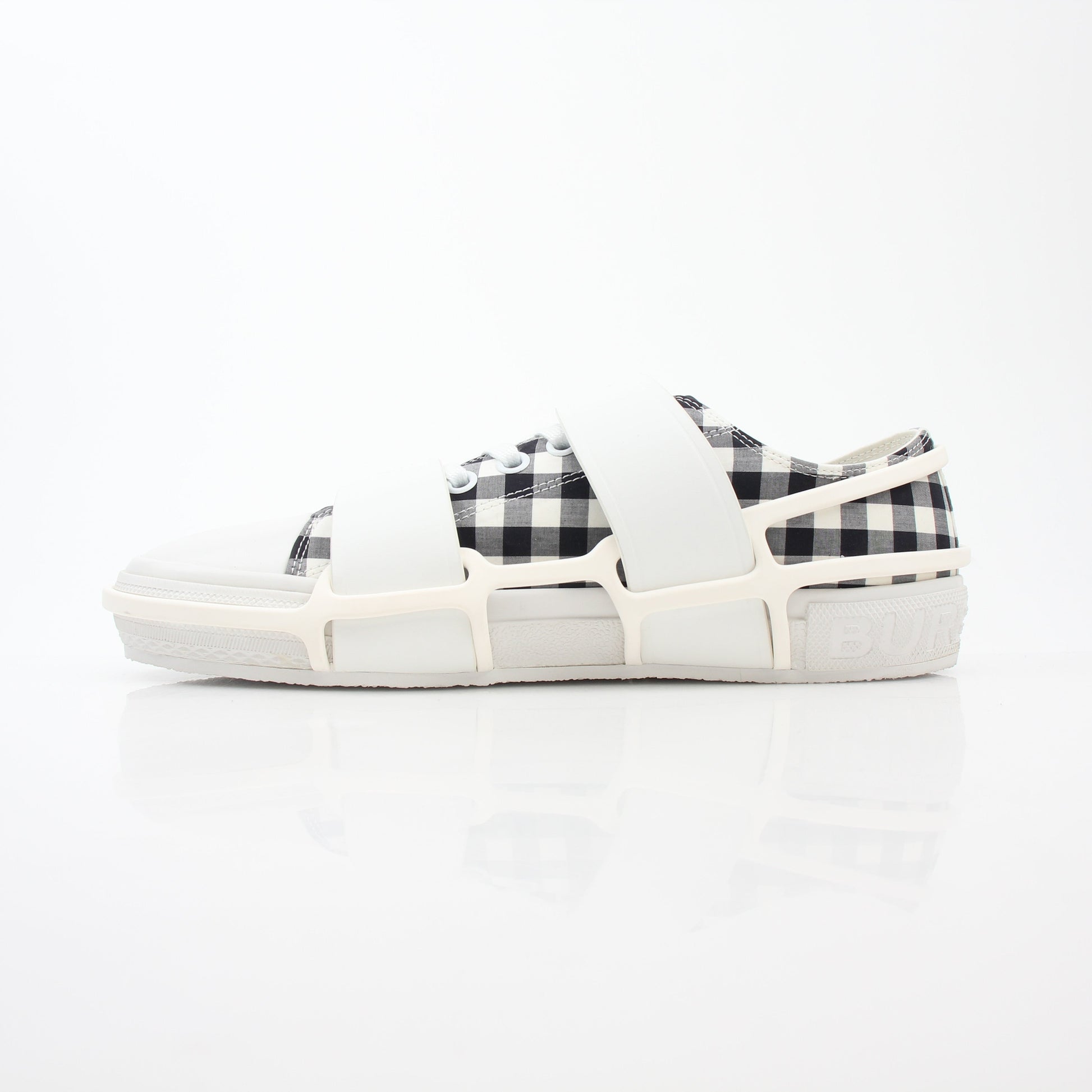 Gold & Beyond Burberry black and white gingham Webb low-top sneakers with white rubber soles and lace-up design.