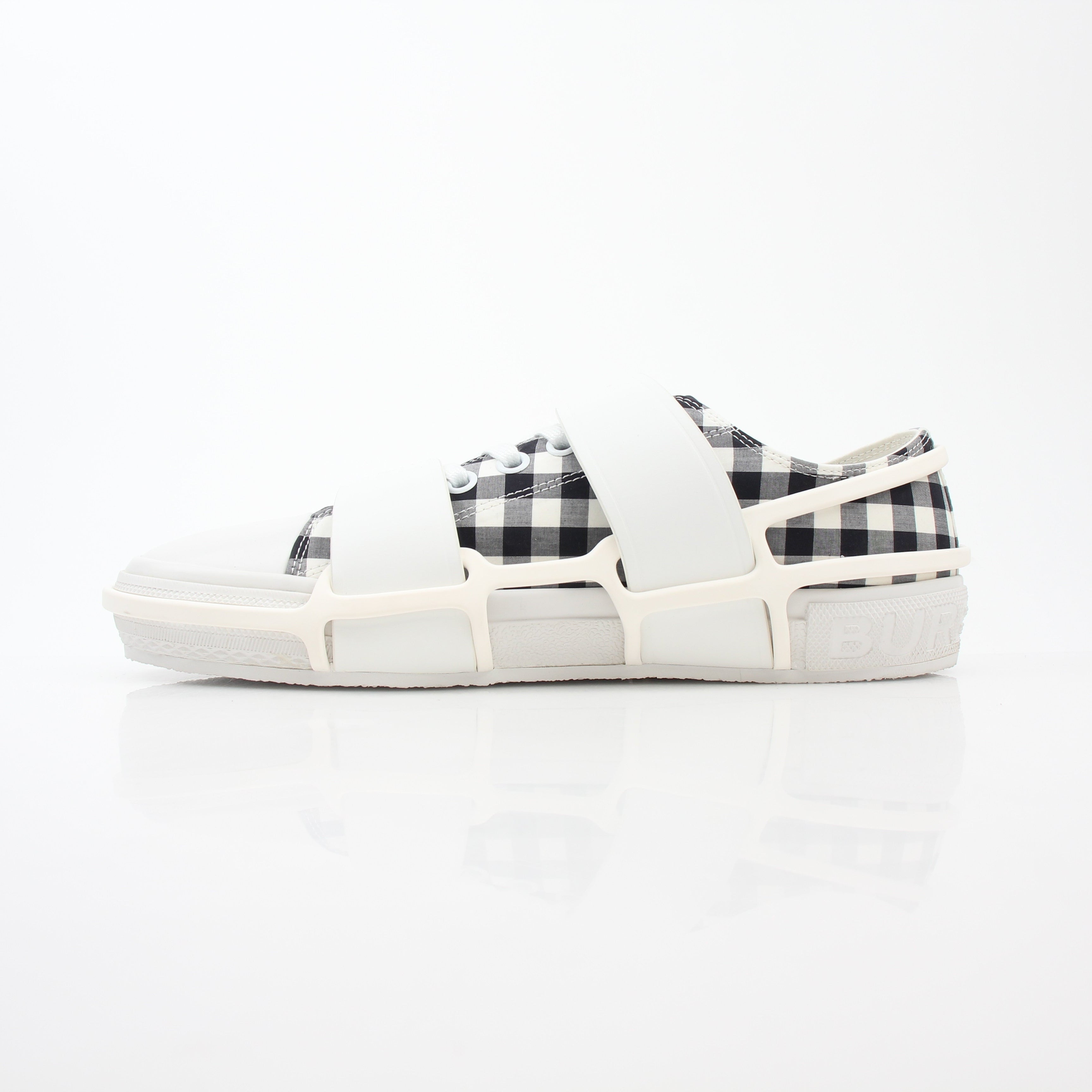 Gold & Beyond Burberry black and white gingham Webb low-top sneakers with white rubber soles and lace-up design.