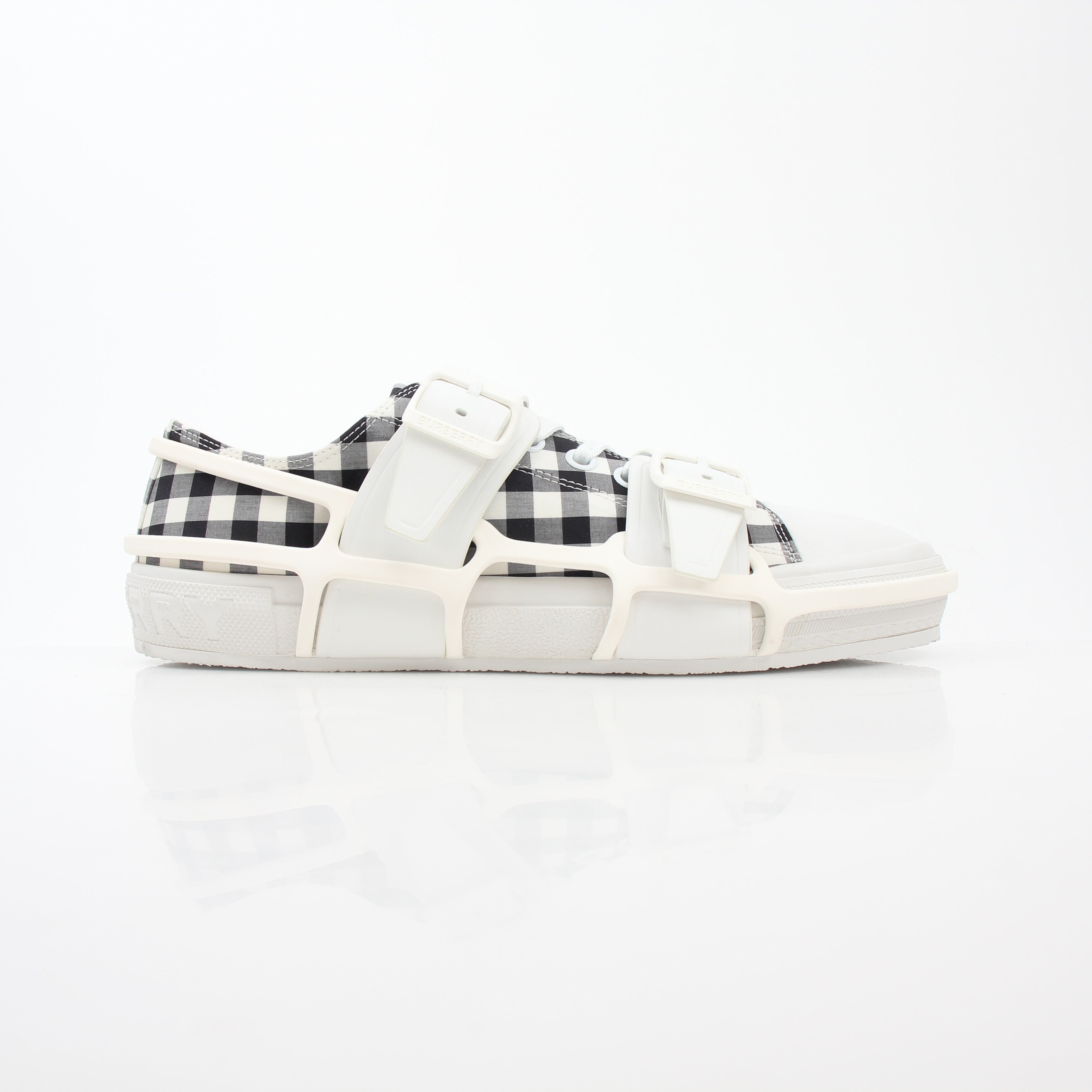 Gold & Beyond Burberry black and white gingham Webb low-top sneakers showing classic pattern and stylish shoe design.