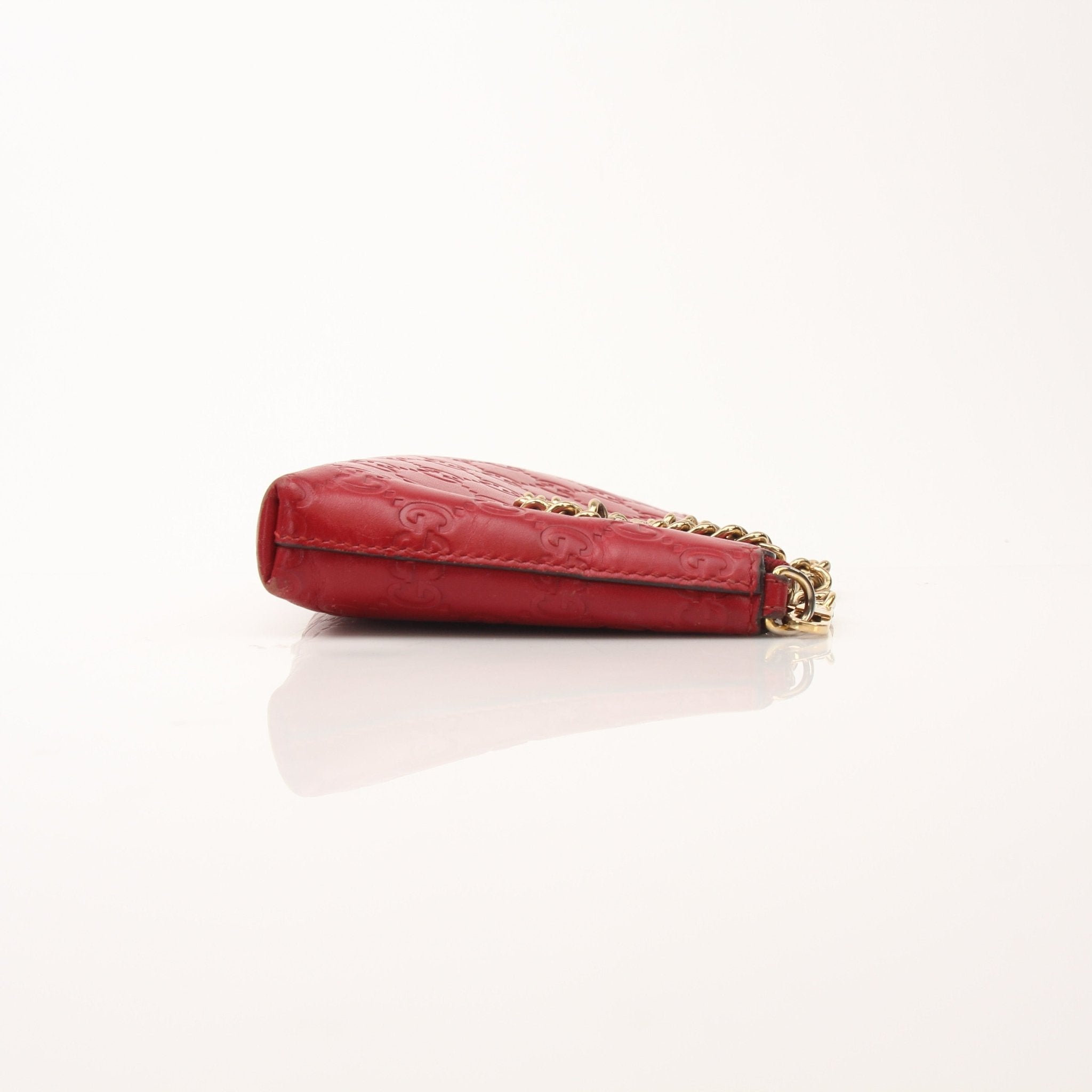 Gucci Guccissima leather chain shoulder handbag with gold hardware and structured design, crafted by Gold & Beyond.