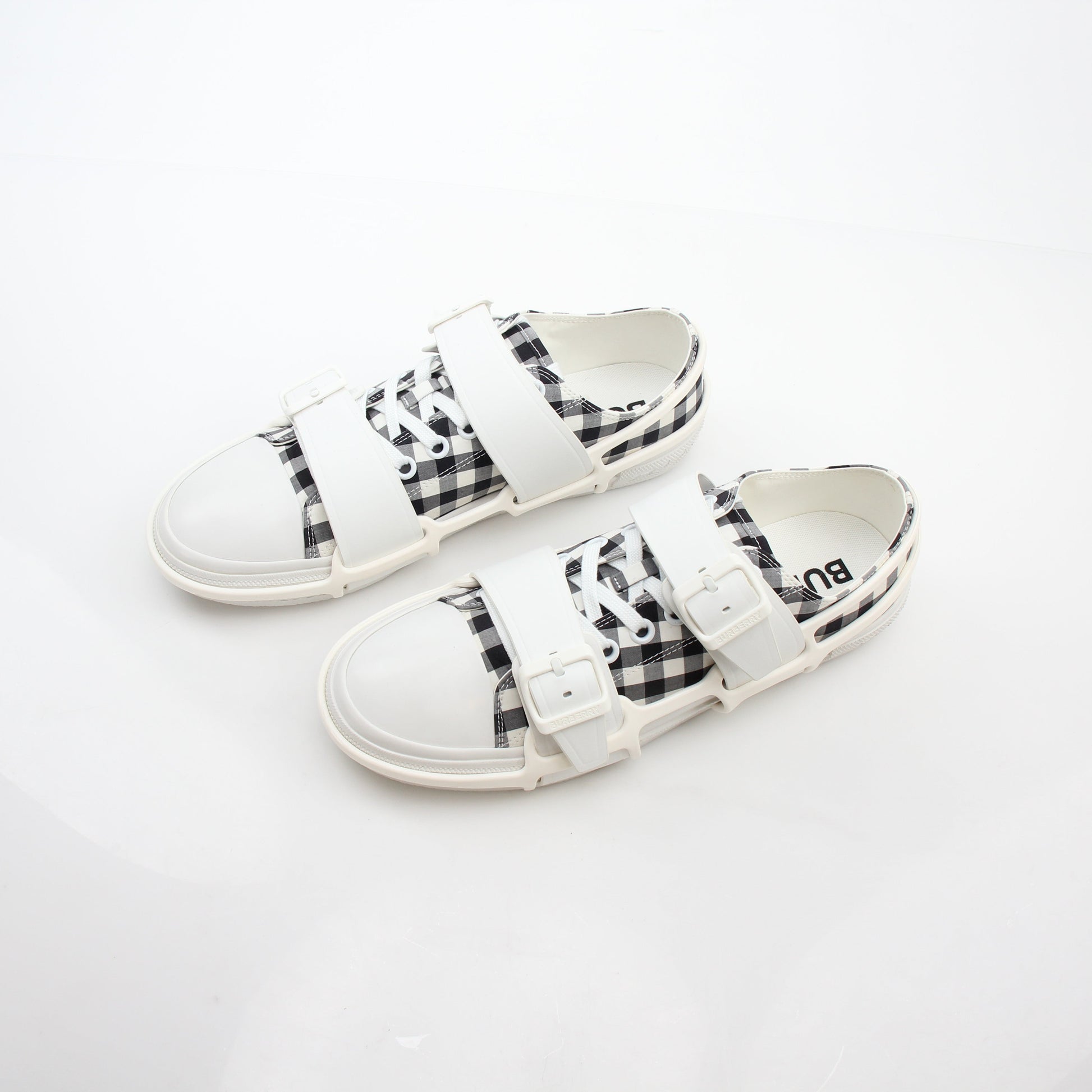 Gold & Beyond Burberry black and white gingham Webb low-top sneakers with lace-up design and rubber sole.