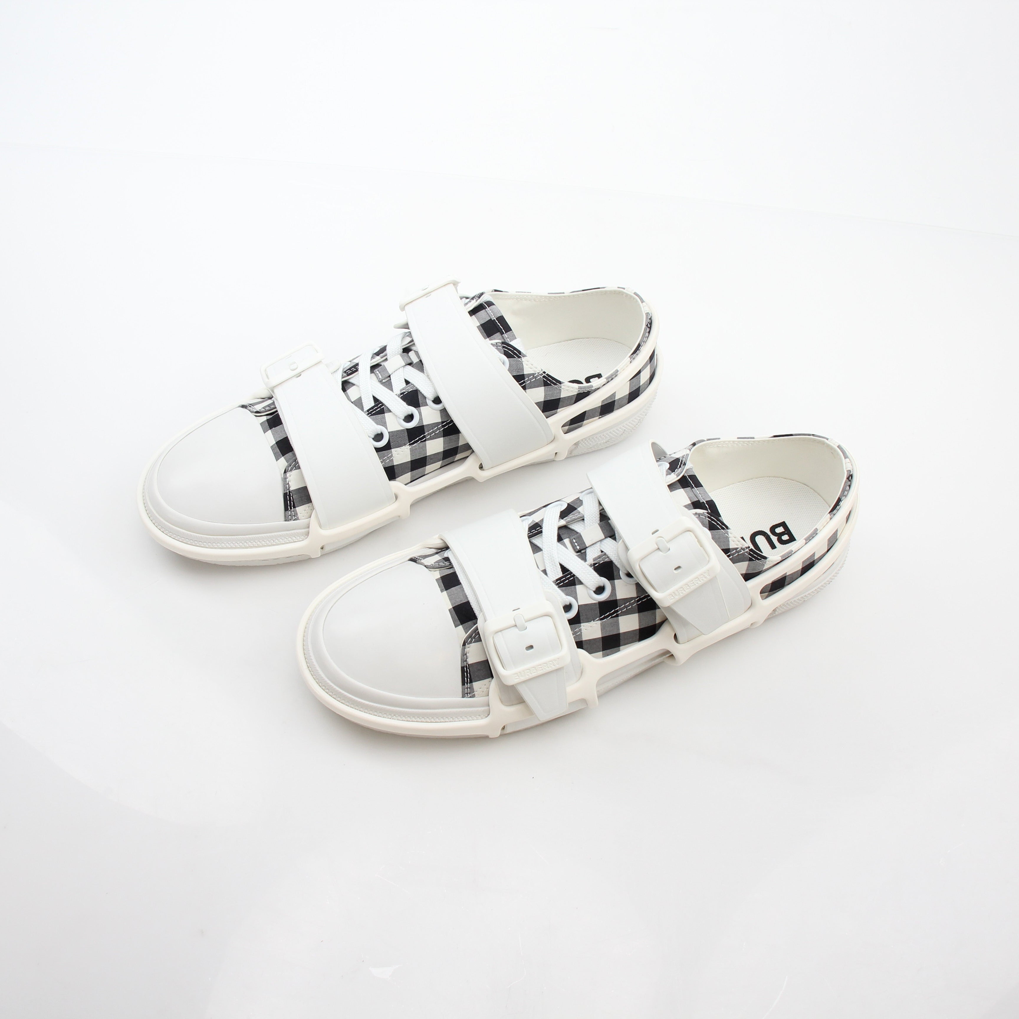 Gold & Beyond Burberry black and white gingham Webb low-top sneakers with lace-up design and rubber sole.