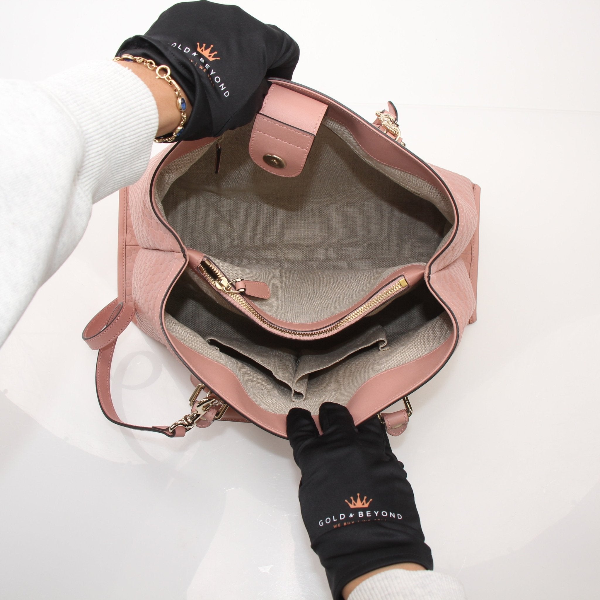 Gold & Beyond Gucci Micro Guccissima top handle tote bag, luxury handbag with signature pattern and structured design.