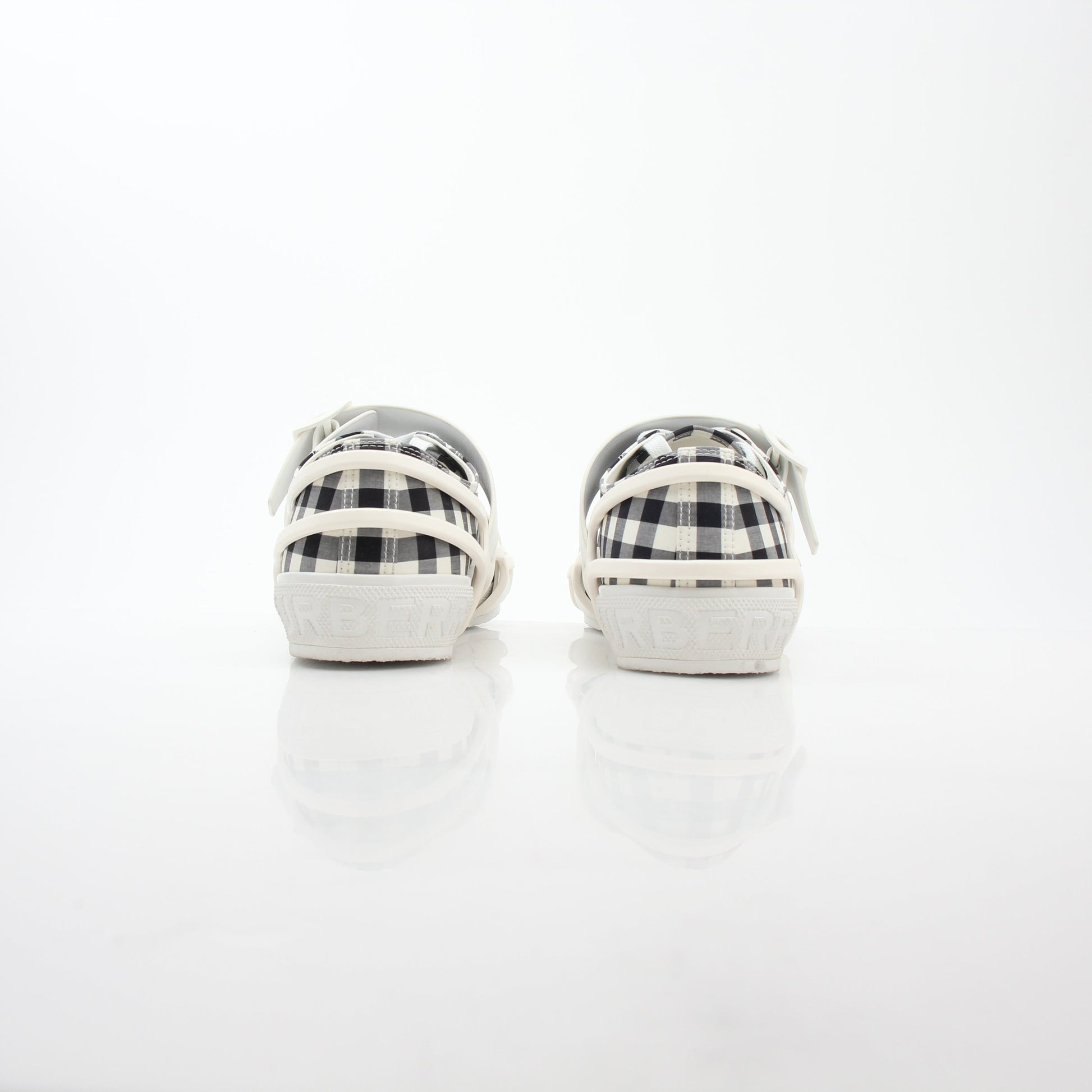 Gold & Beyond Burberry black and white gingham Webb low-top sneakers, showing classic check pattern and white rubber sole.