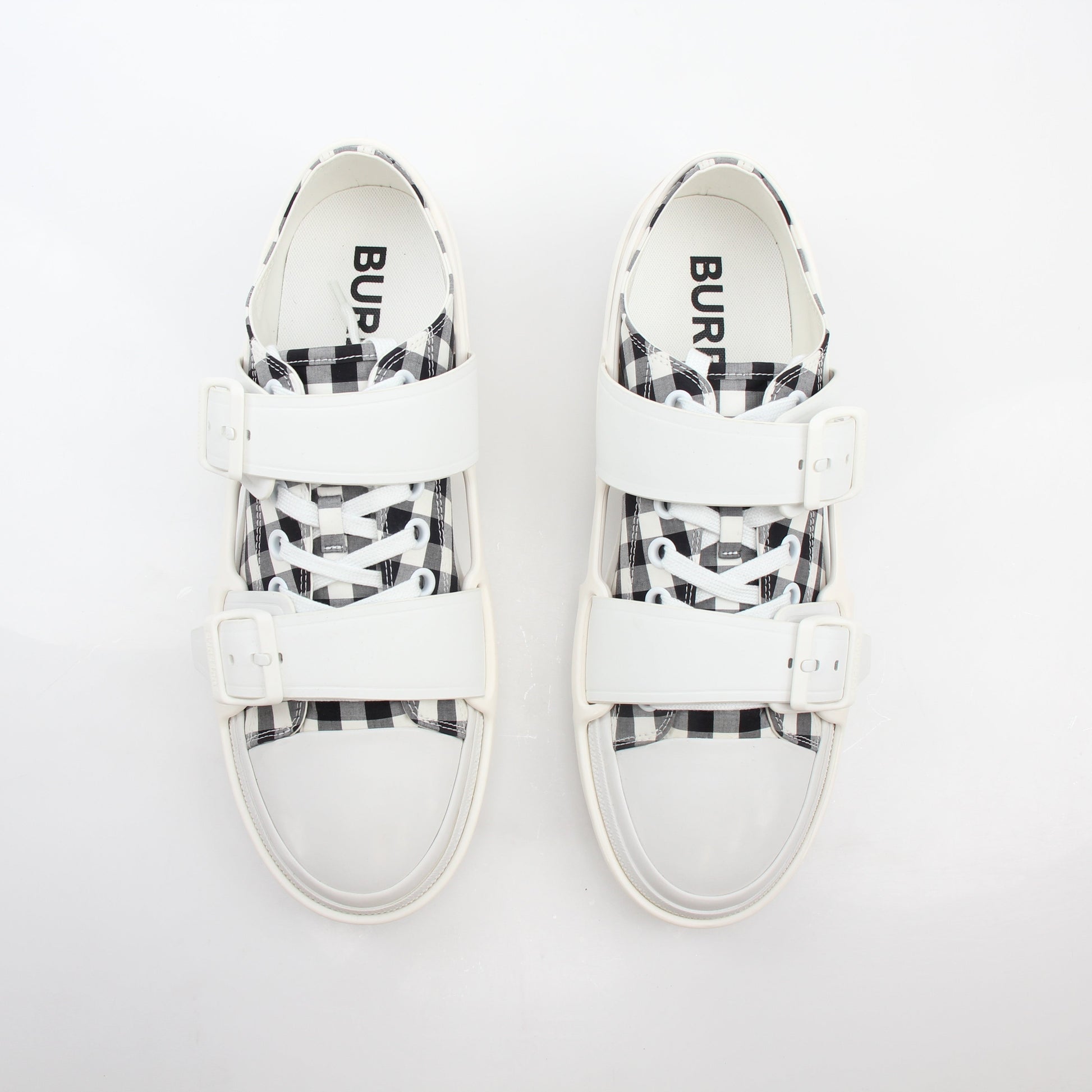 Gold & Beyond Burberry black and white gingham Webb low-top sneakers featuring classic check pattern and white rubber soles.