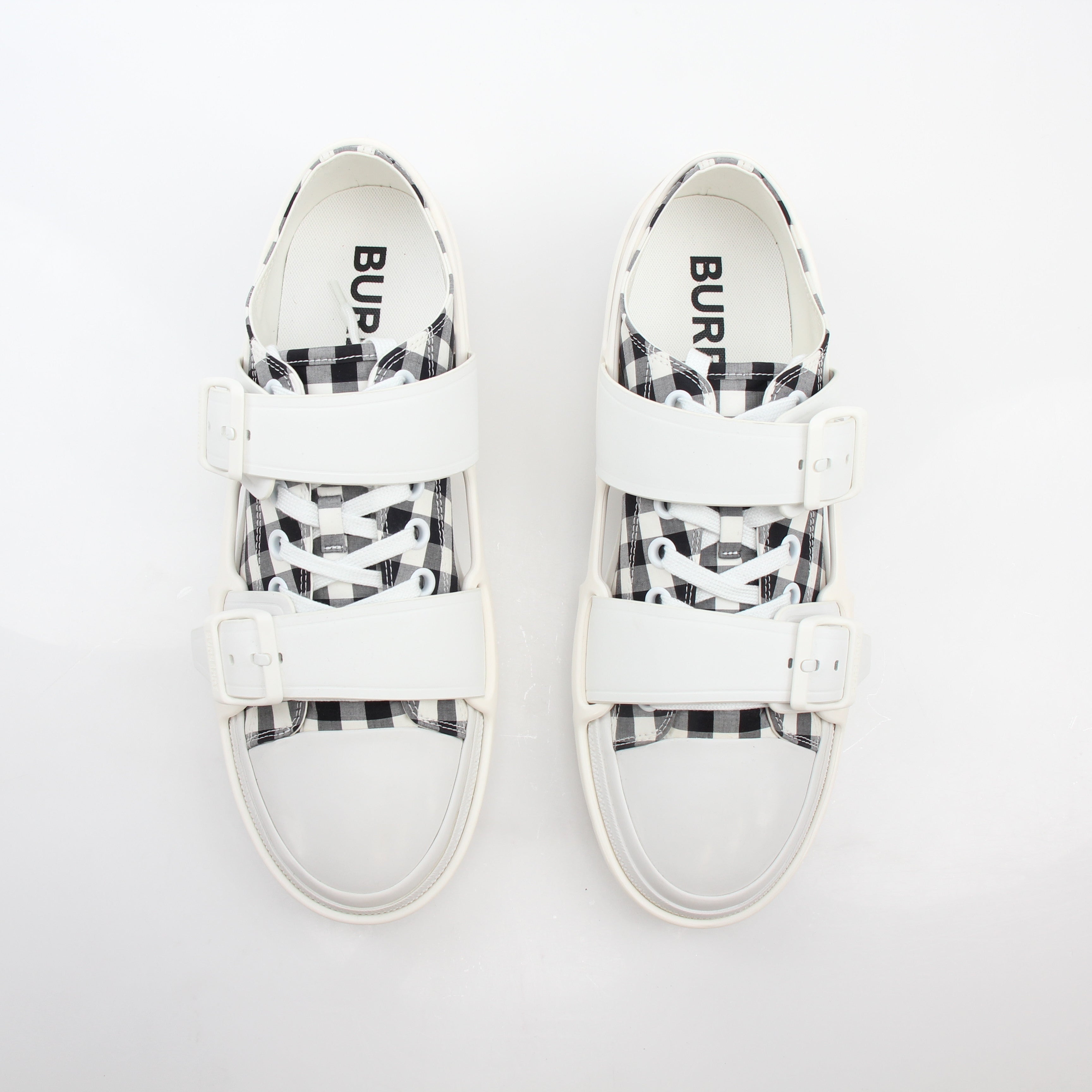 Gold & Beyond Burberry black and white gingham Webb low-top sneakers featuring classic check pattern and white rubber soles.