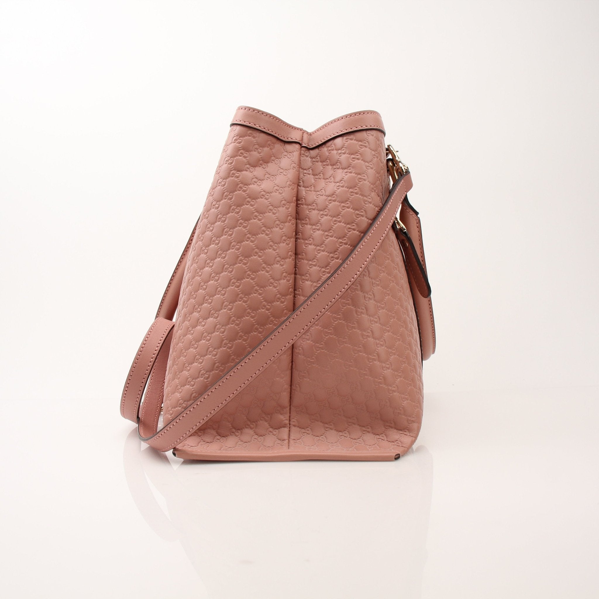 Gold & Beyond Gucci Micro Guccissima top handle tote bag with structured design and signature pattern, perfect for stylish everyday use.