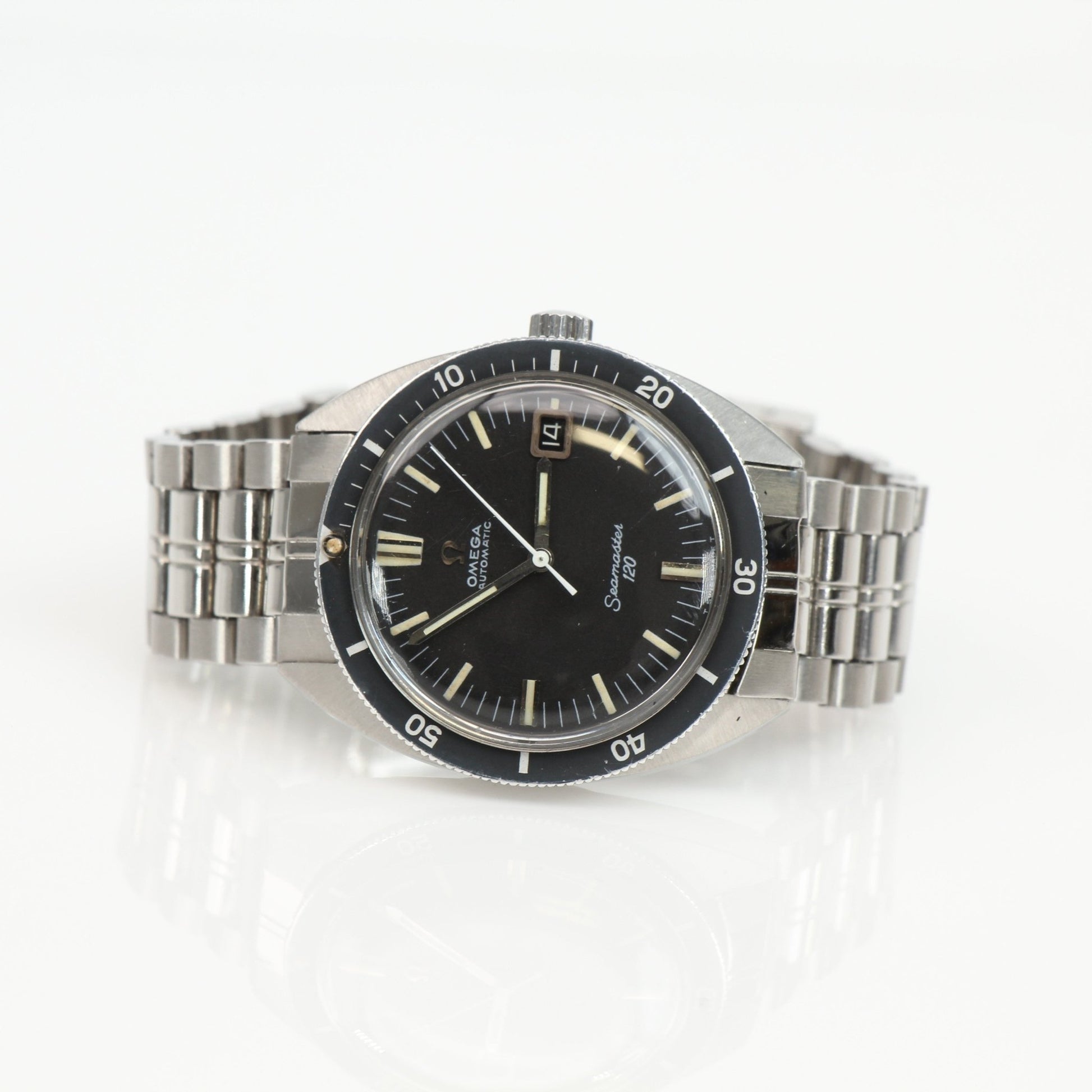 Omega Seamaster 120 vintage diver watch with a black dial, stainless steel case, and classic design from Gold & Beyond.