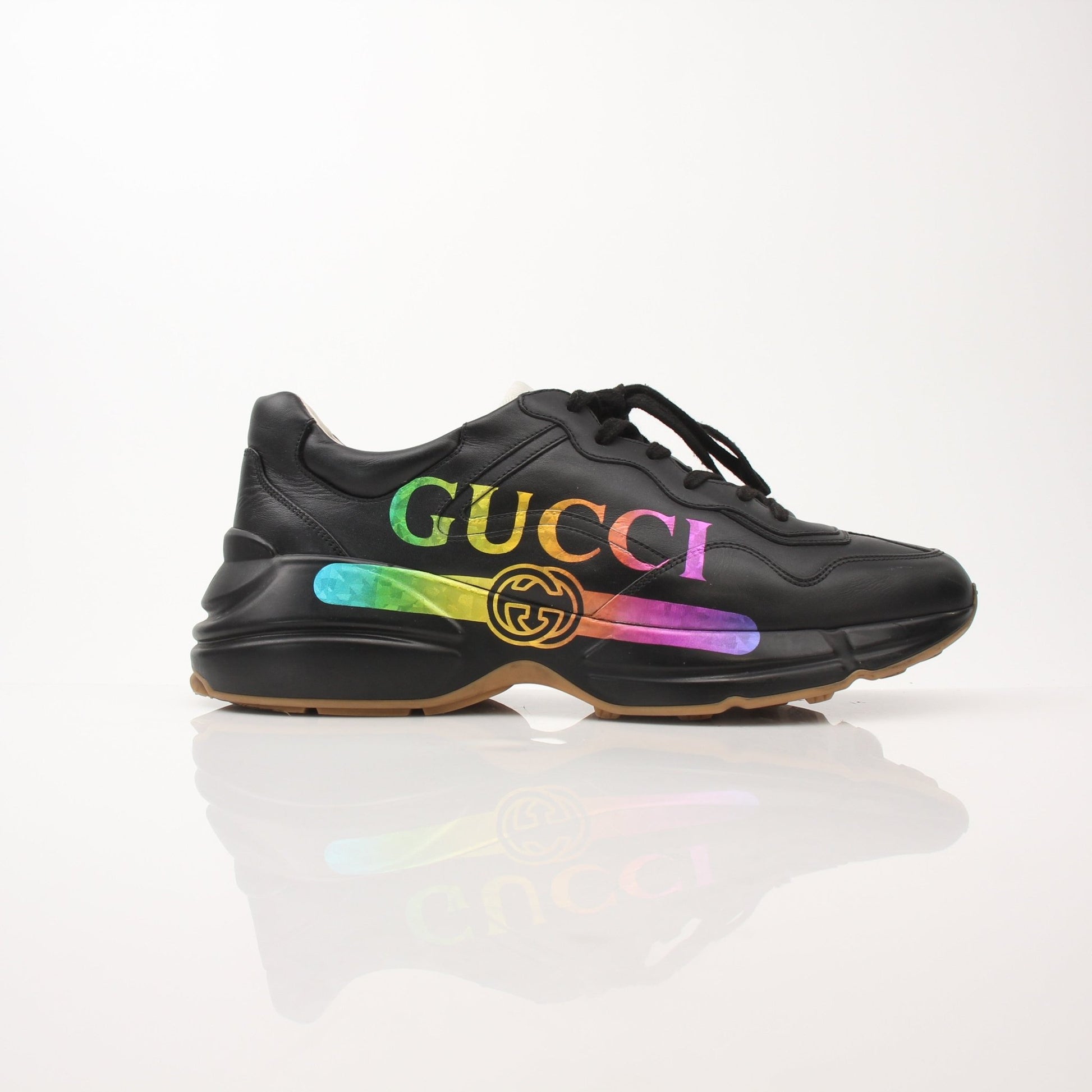 Gold & Beyond Gucci men's Rython iridescent logo sneakers, stylish shoes with shiny, reflective surface and iconic branding.