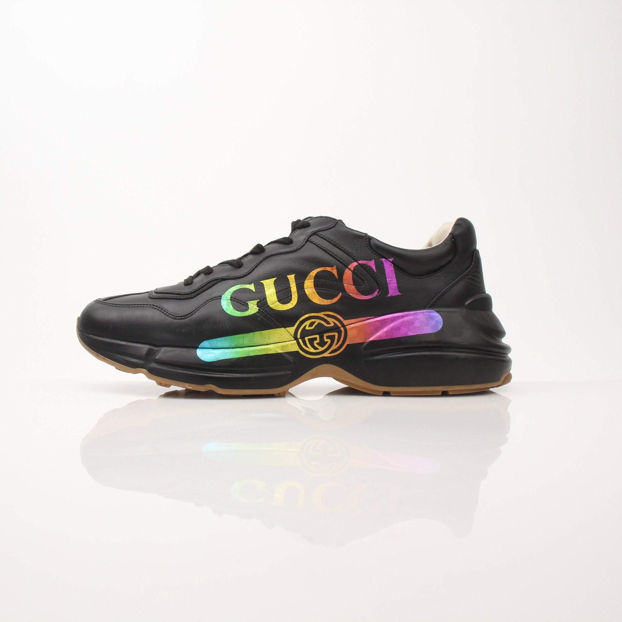 Gold & Beyond Gucci Men’s Rython iridescent logo sneakers with sleek design and colorful detailing, showcasing stylish men's shoes.