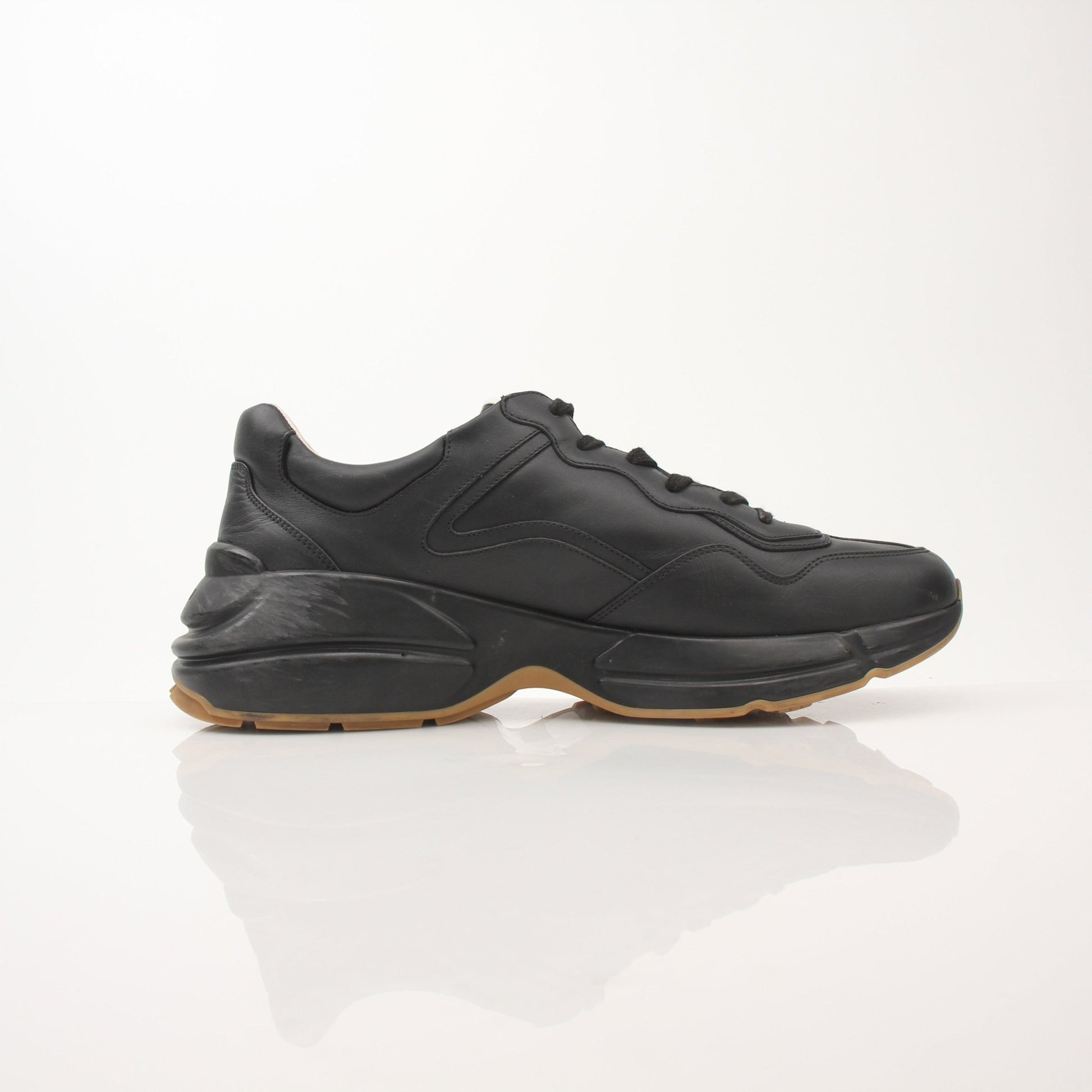Gold & Beyond Gucci men's Rython iridescent logo sneakers with sleek design and reflective surface, showcasing stylish footwear.